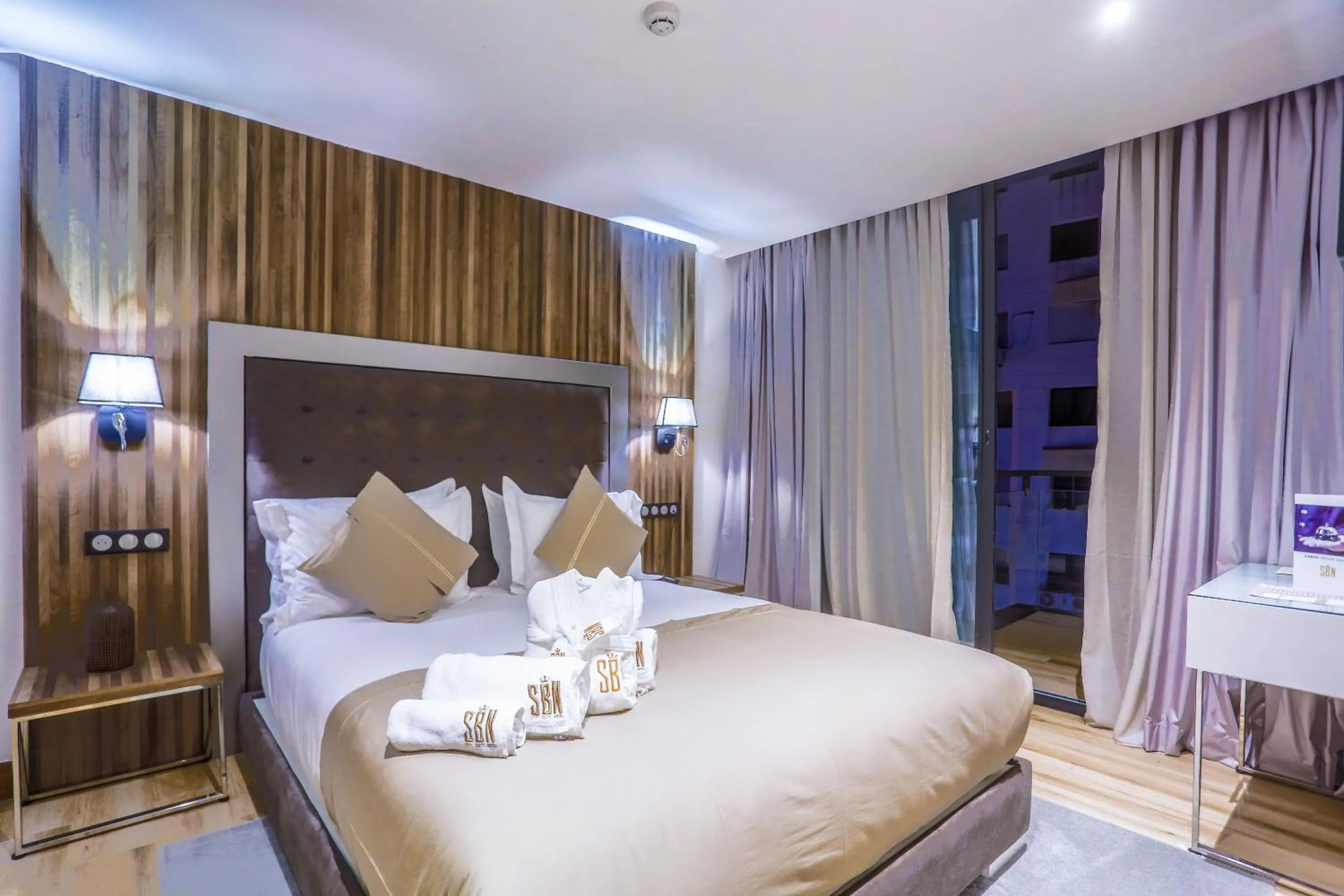 Bed in SBN Suite Hôtel