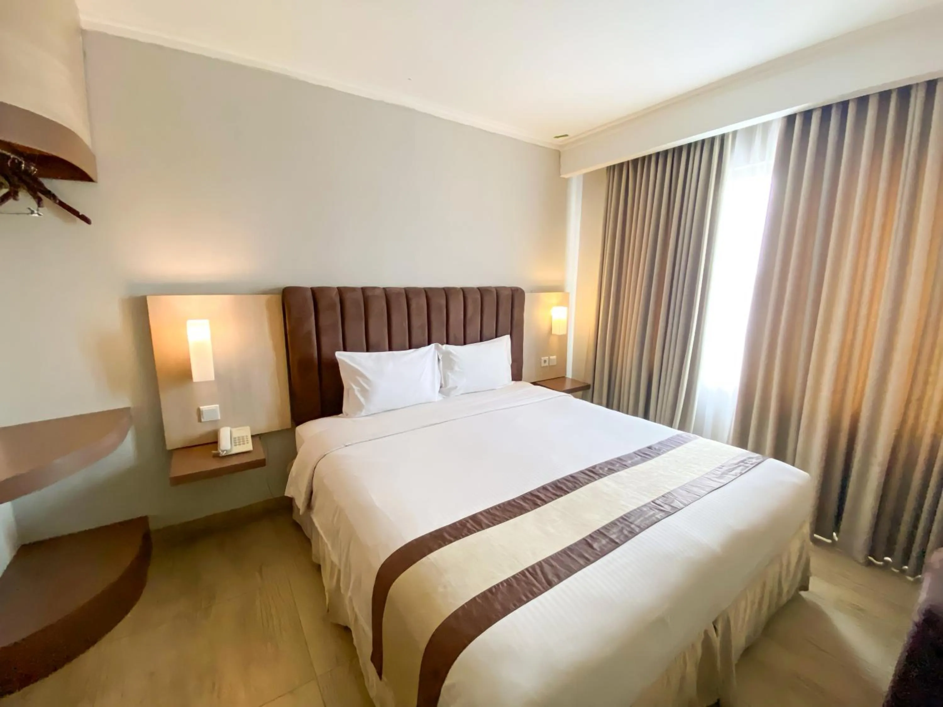 Bed in Bueno Colombo Hotel Yogyakarta