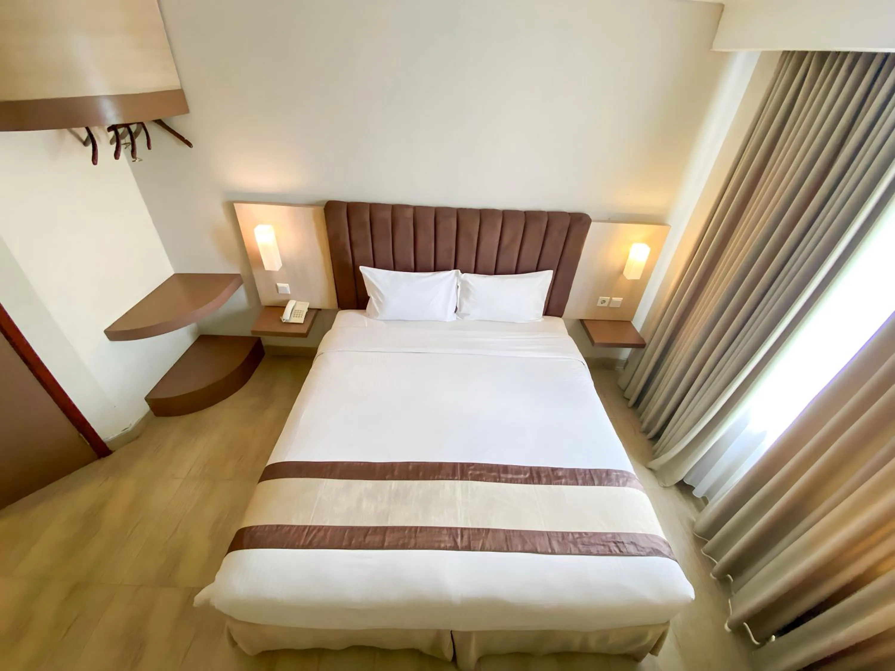 Bed in Bueno Colombo Hotel Yogyakarta