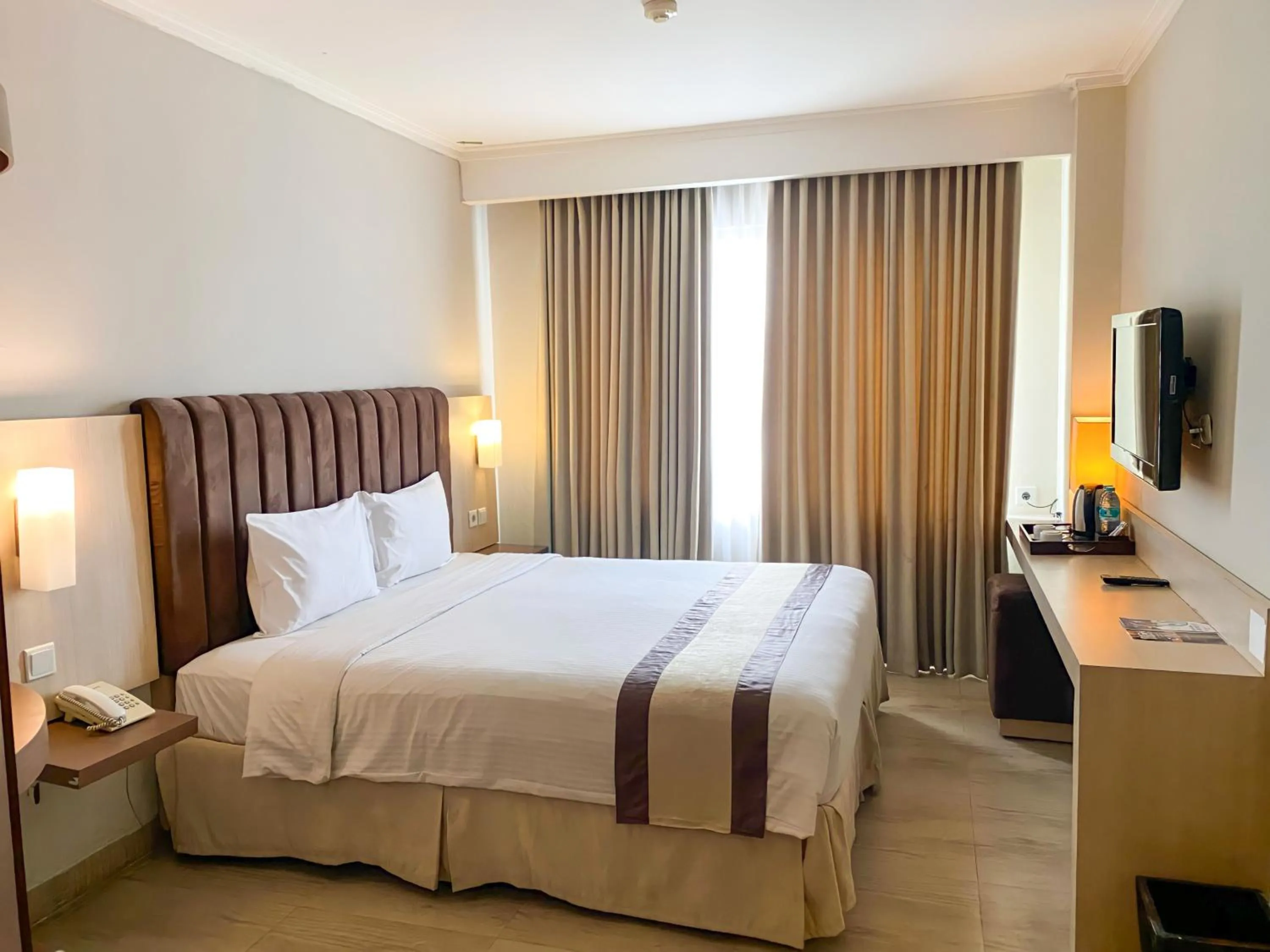 Bed in Bueno Colombo Hotel Yogyakarta