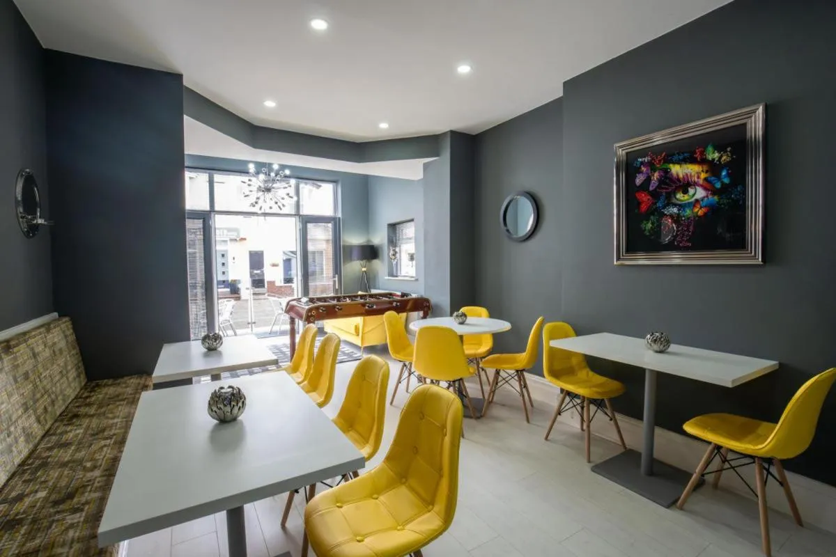 Communal lounge/ TV room in The Gables Hotel by Cherish Lewis Blackpool