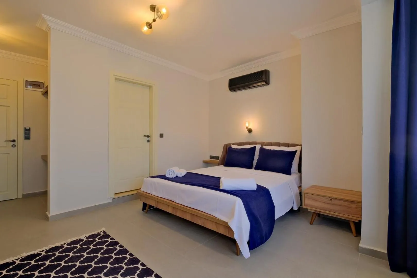Bed in Ciello Suites Hotel