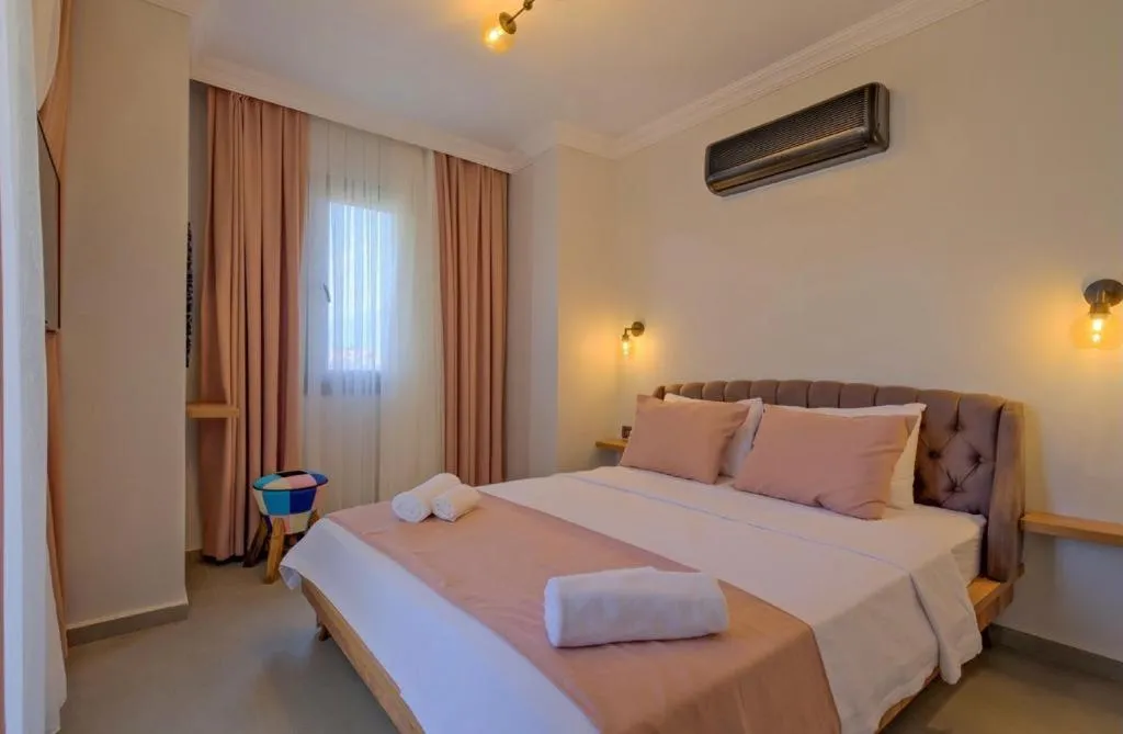 Bed in Ciello Suites Hotel