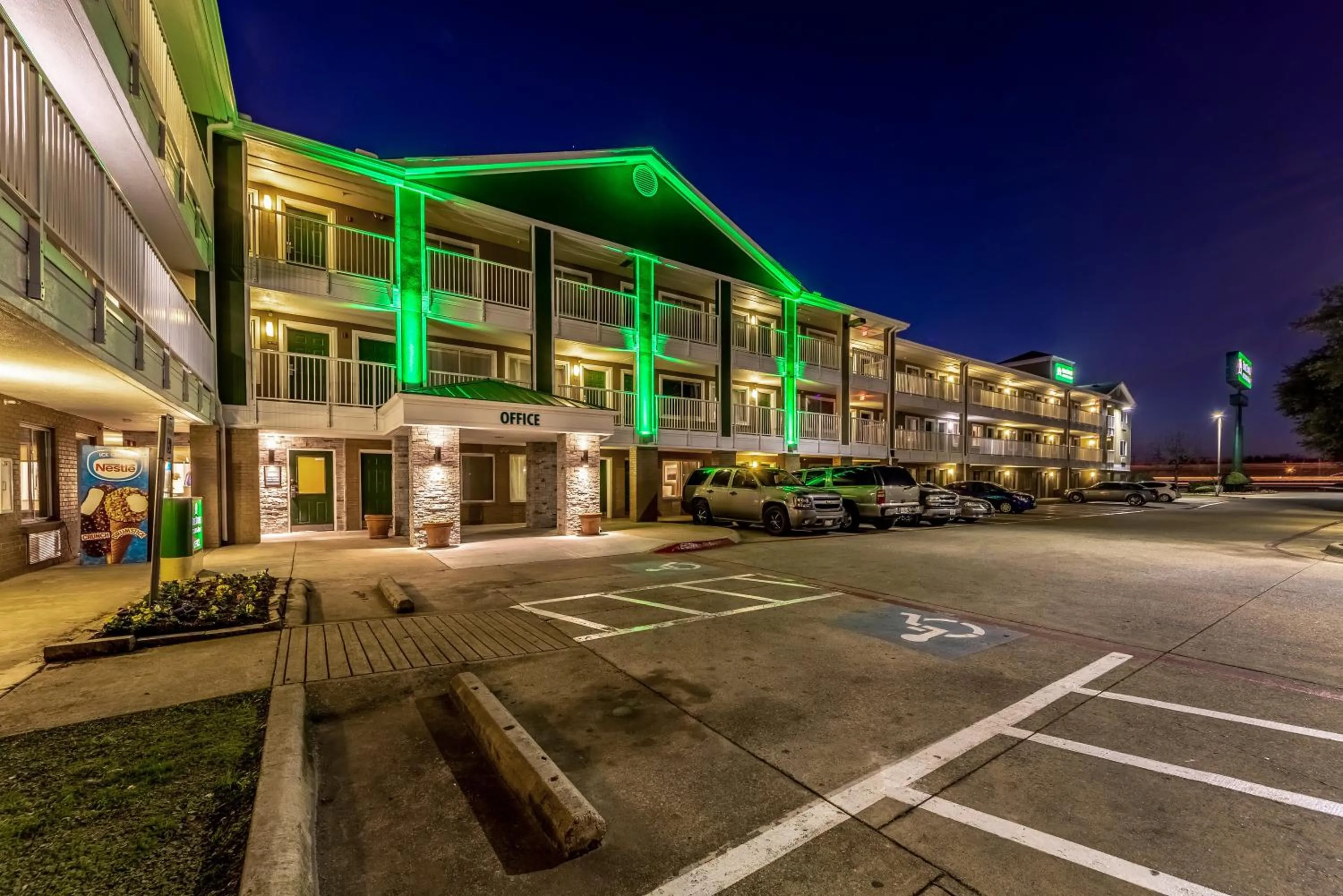 Property building in HomeTowne Studios by Red Roof Dallas - Mesquite