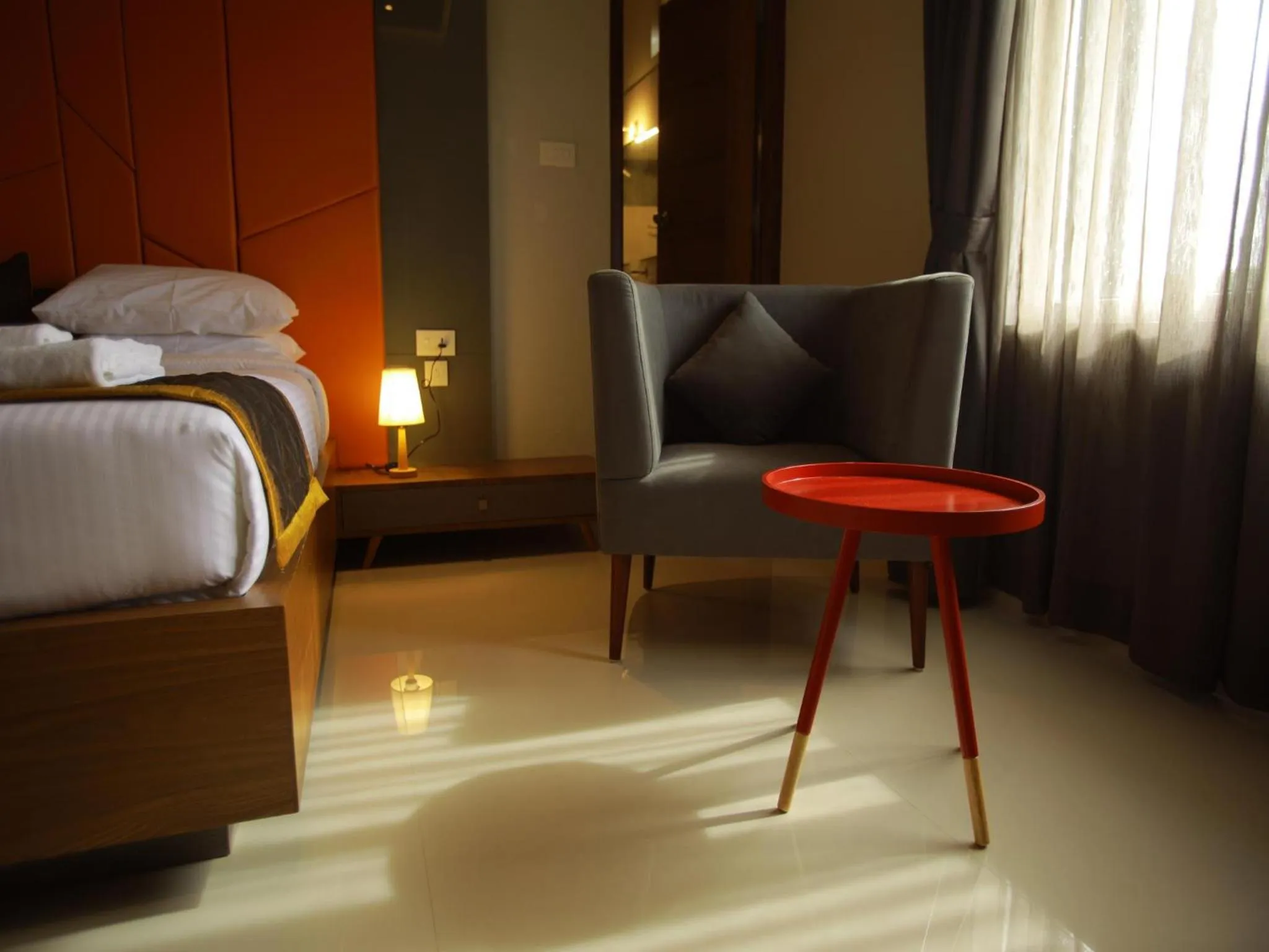Seating area, Bed in WithInn Hotel - Kannur Airport