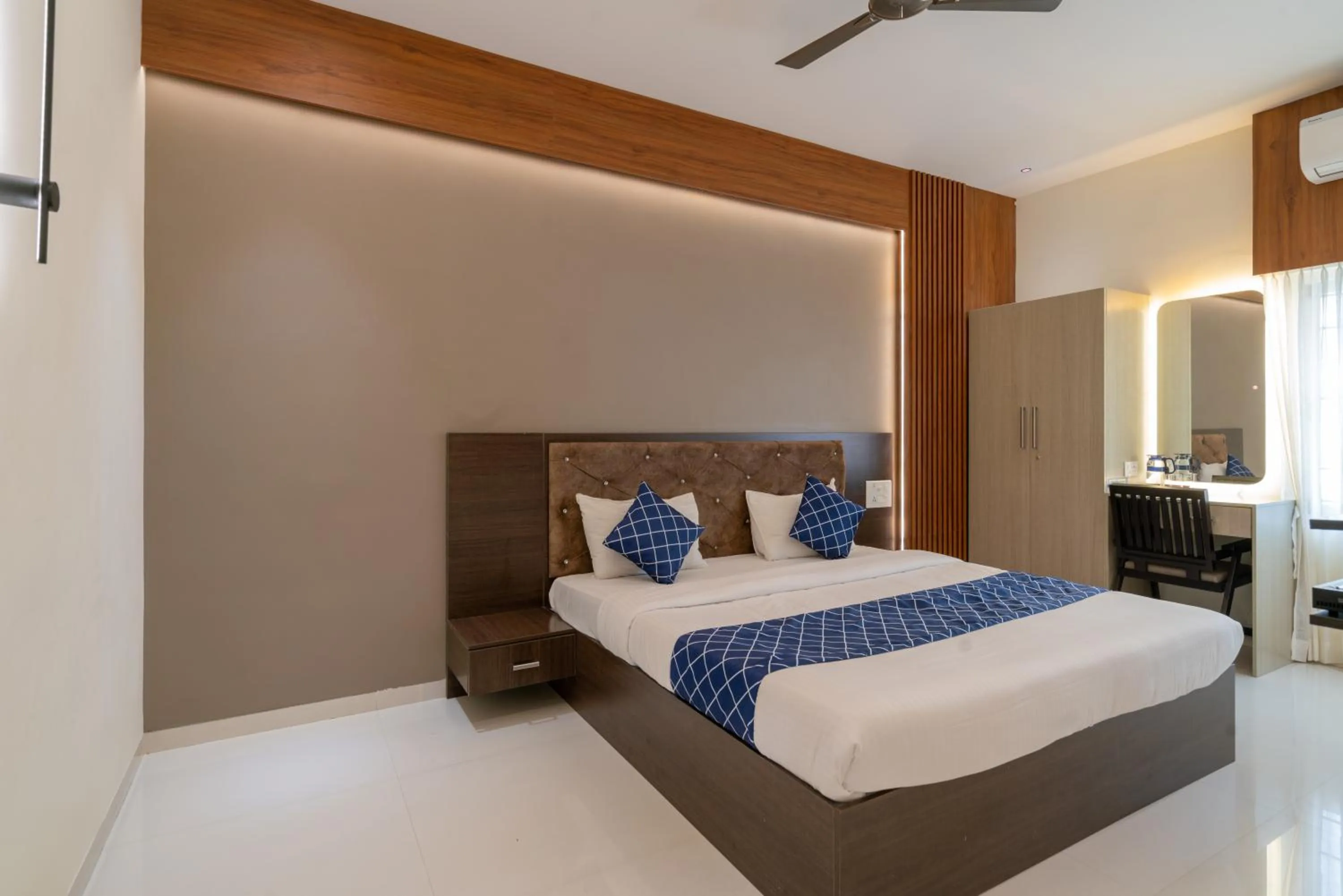 Bed in THE SURRYA MAX RESIDENCY