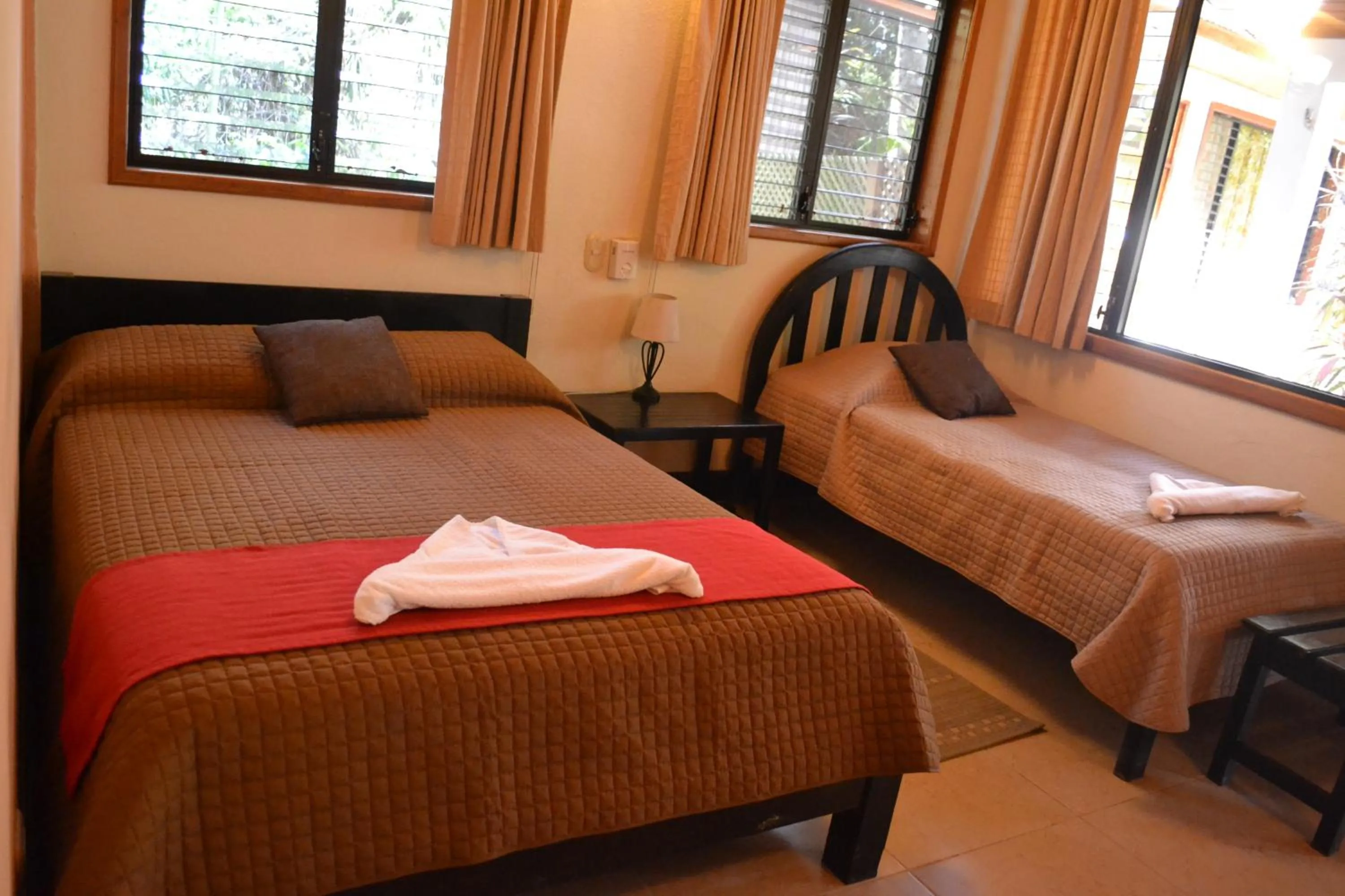 Decorative detail, Bed in Hotel Jaguar Inn Tikal