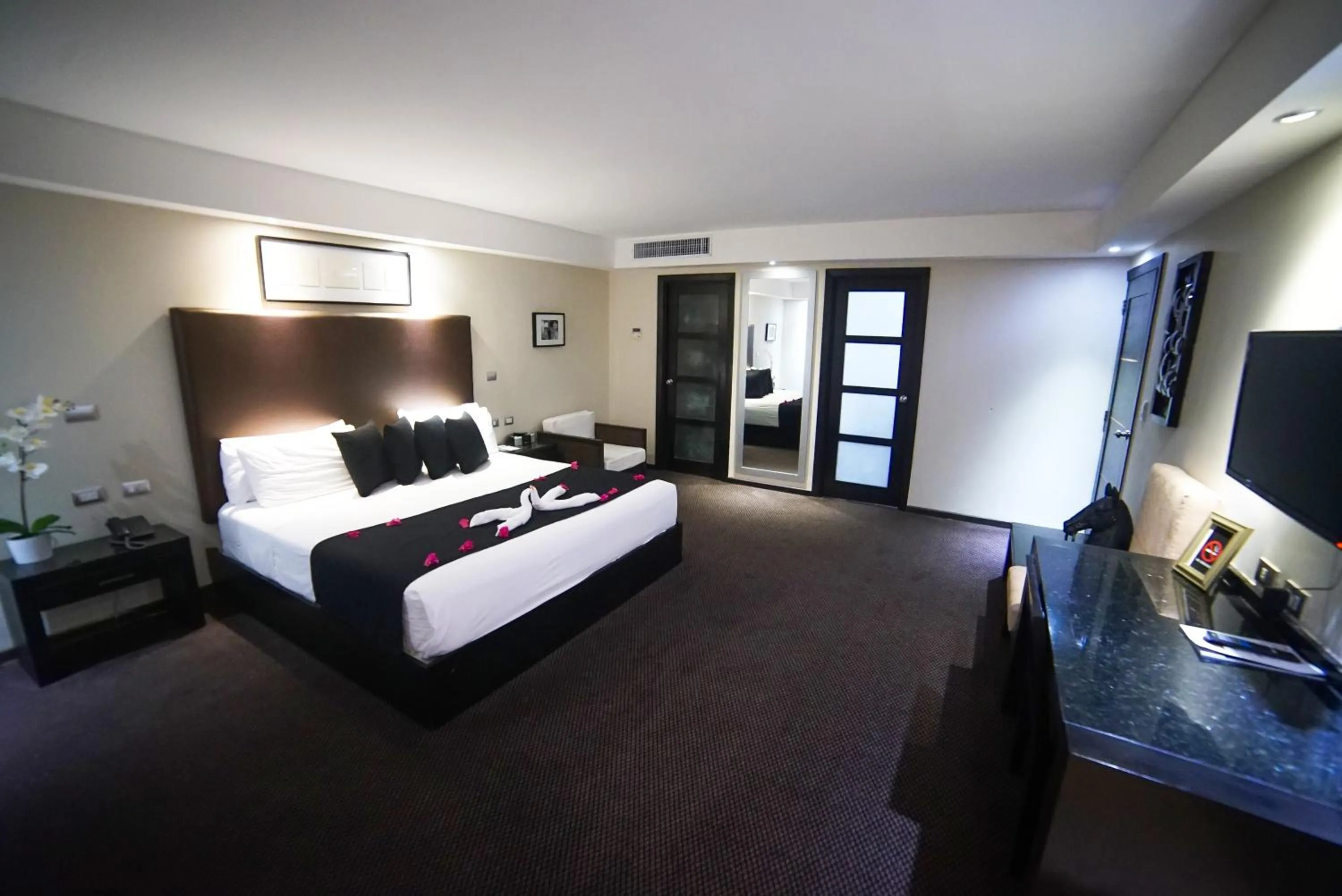 Bed in Savoy Hotel Boutique