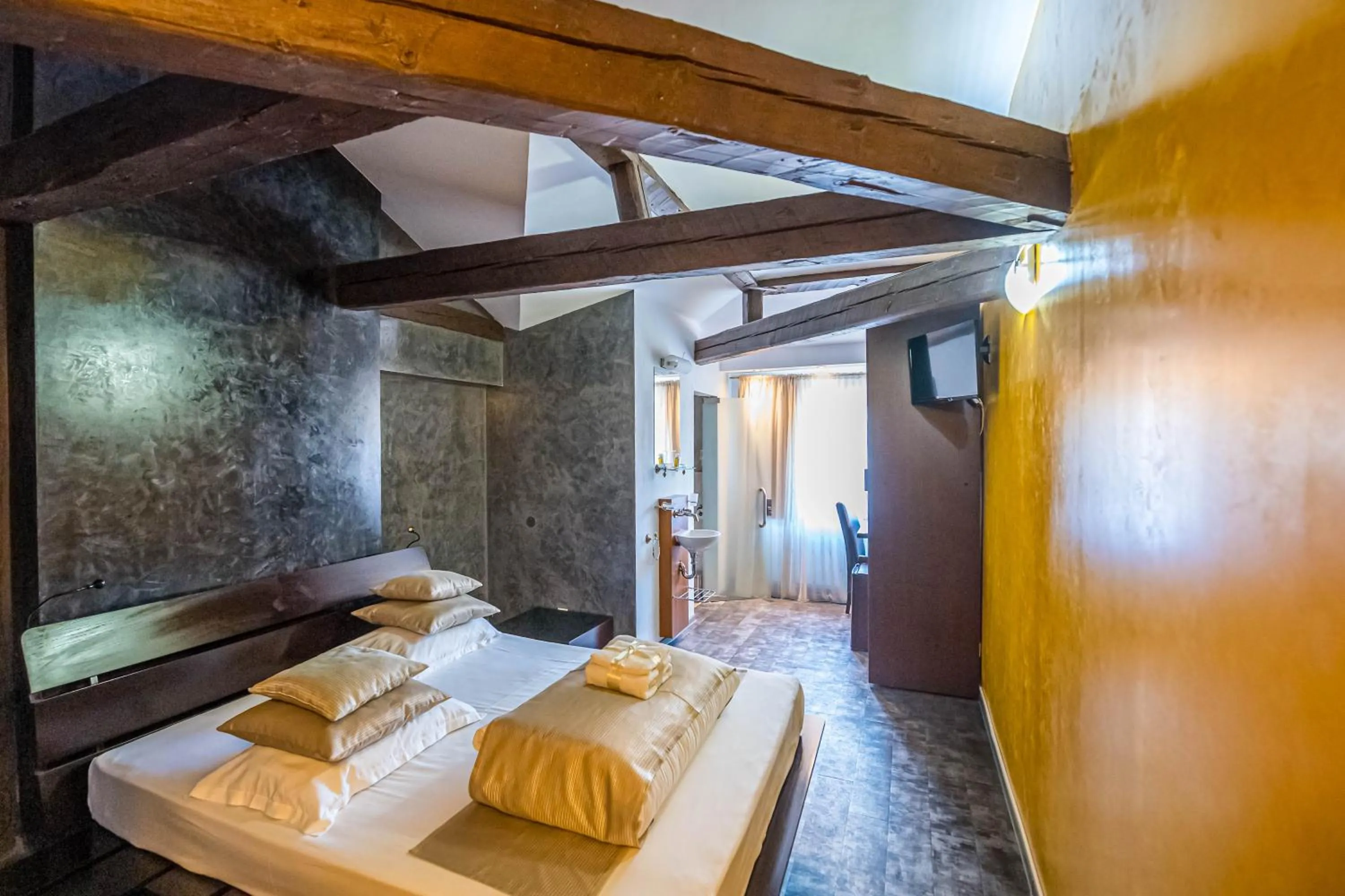 Bed in Do Stil Boutique Hotel