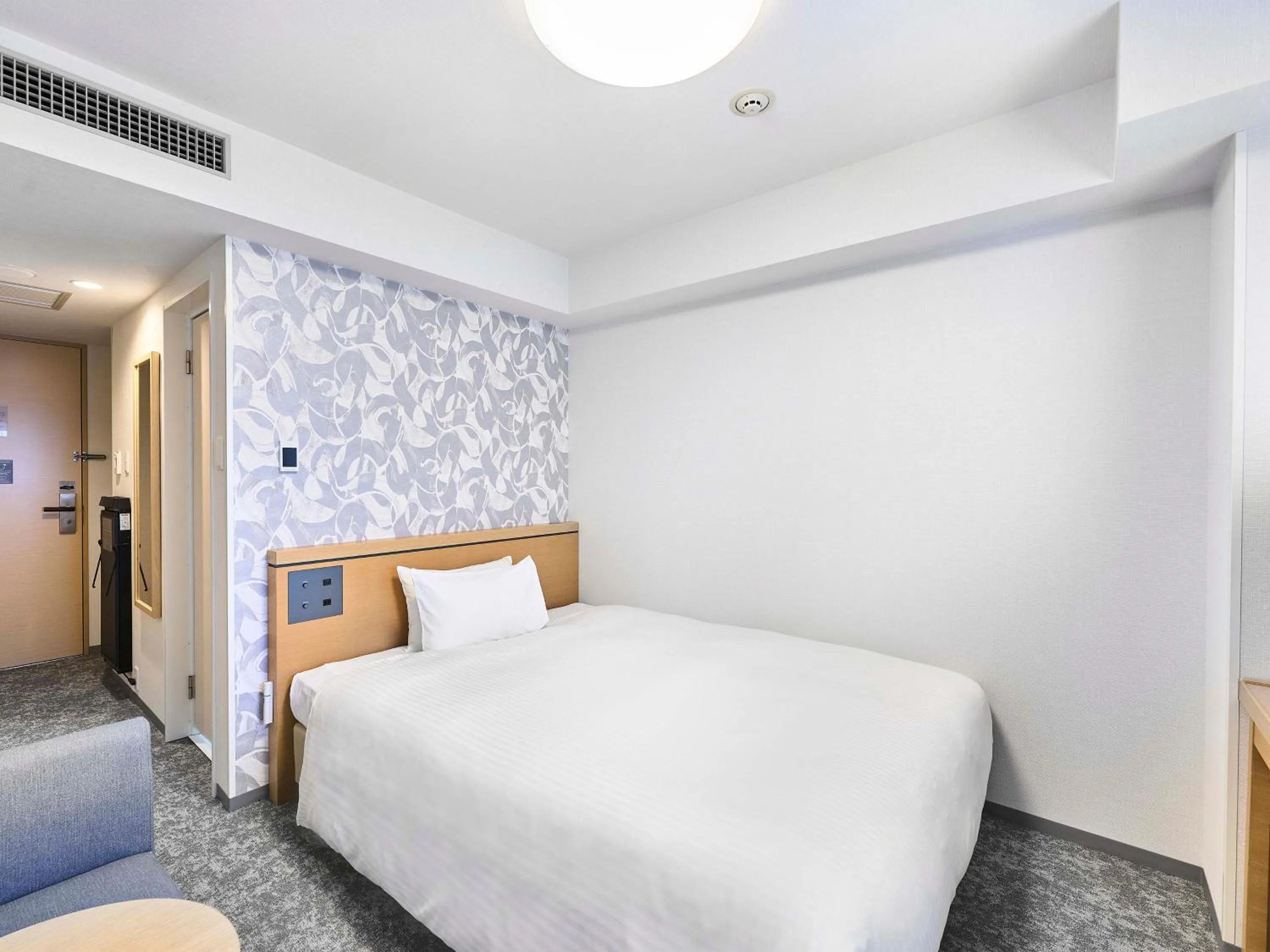 Bed in Daiwa Roynet Hotel Naha Kokusaidori