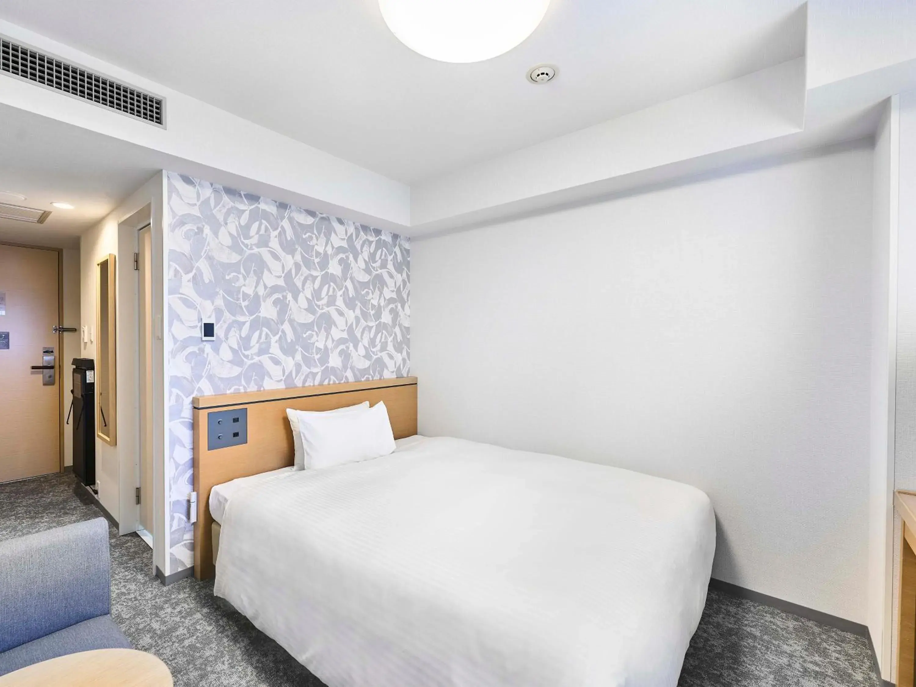 Bed in Daiwa Roynet Hotel Naha Kokusaidori Bed in Daiwa Roynet Hotel Naha Kokusaidori