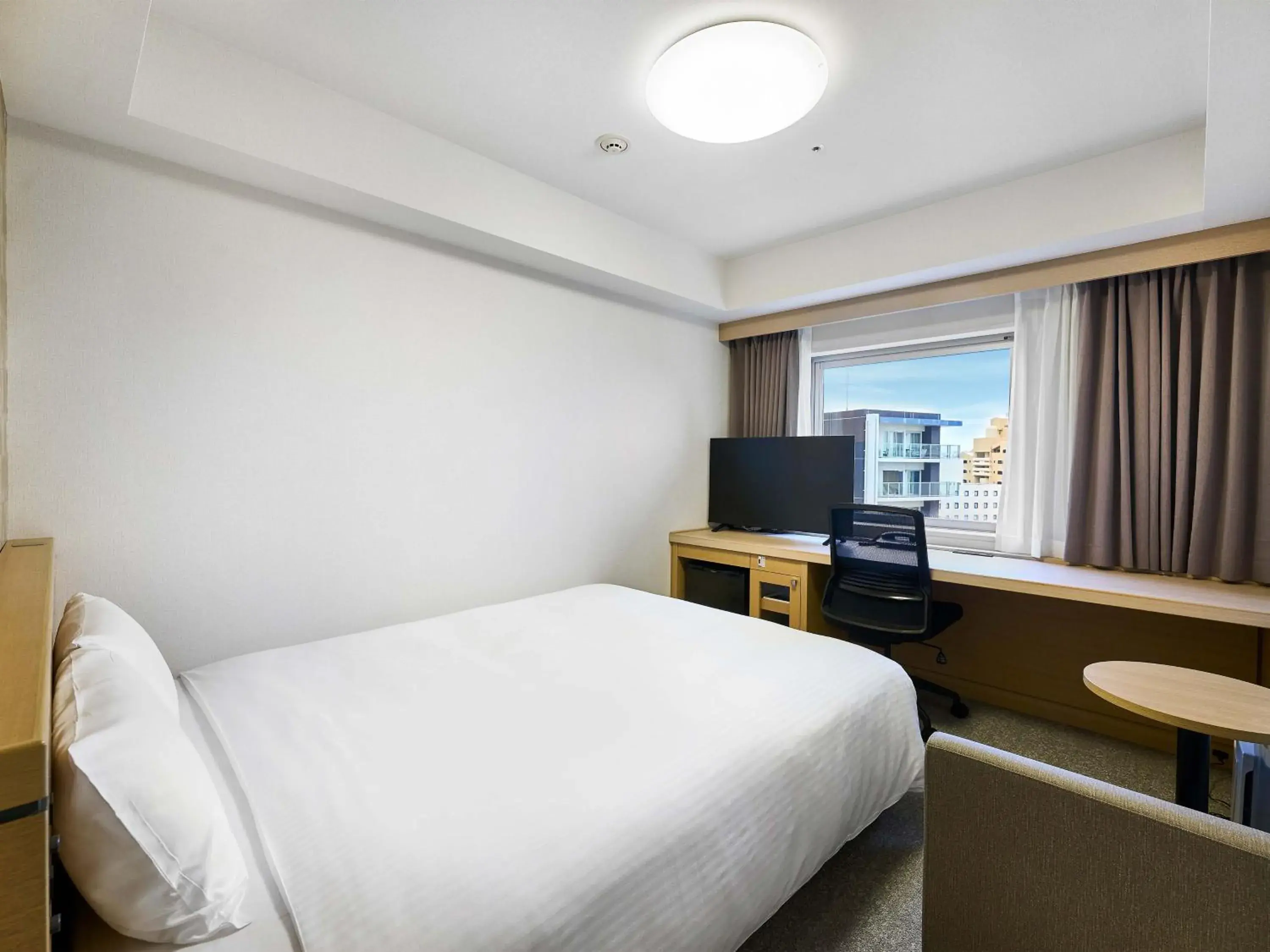 Bed in Daiwa Roynet Hotel Naha Kokusaidori Bed in Daiwa Roynet Hotel Naha Kokusaidori