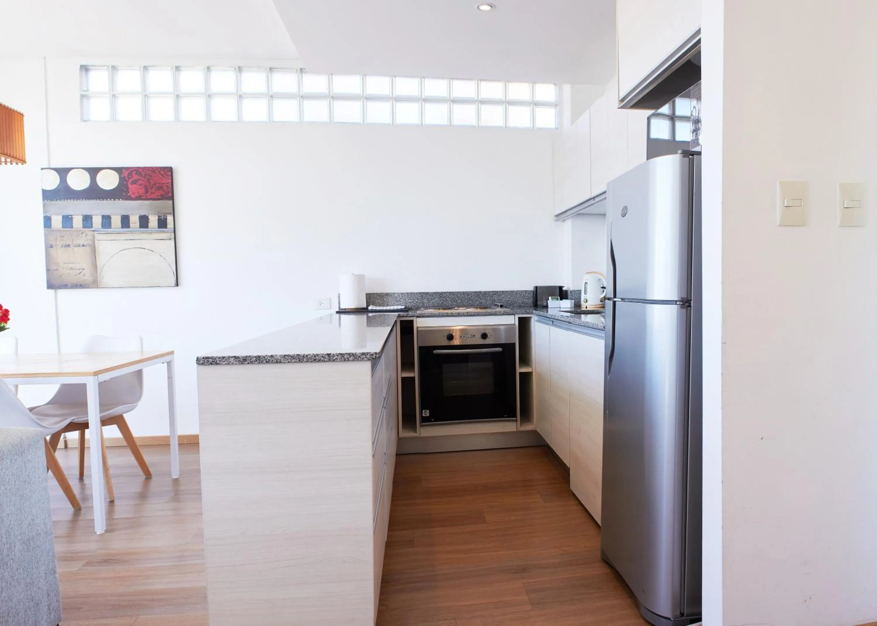 Kitchen or kitchenette in Monroe Suites