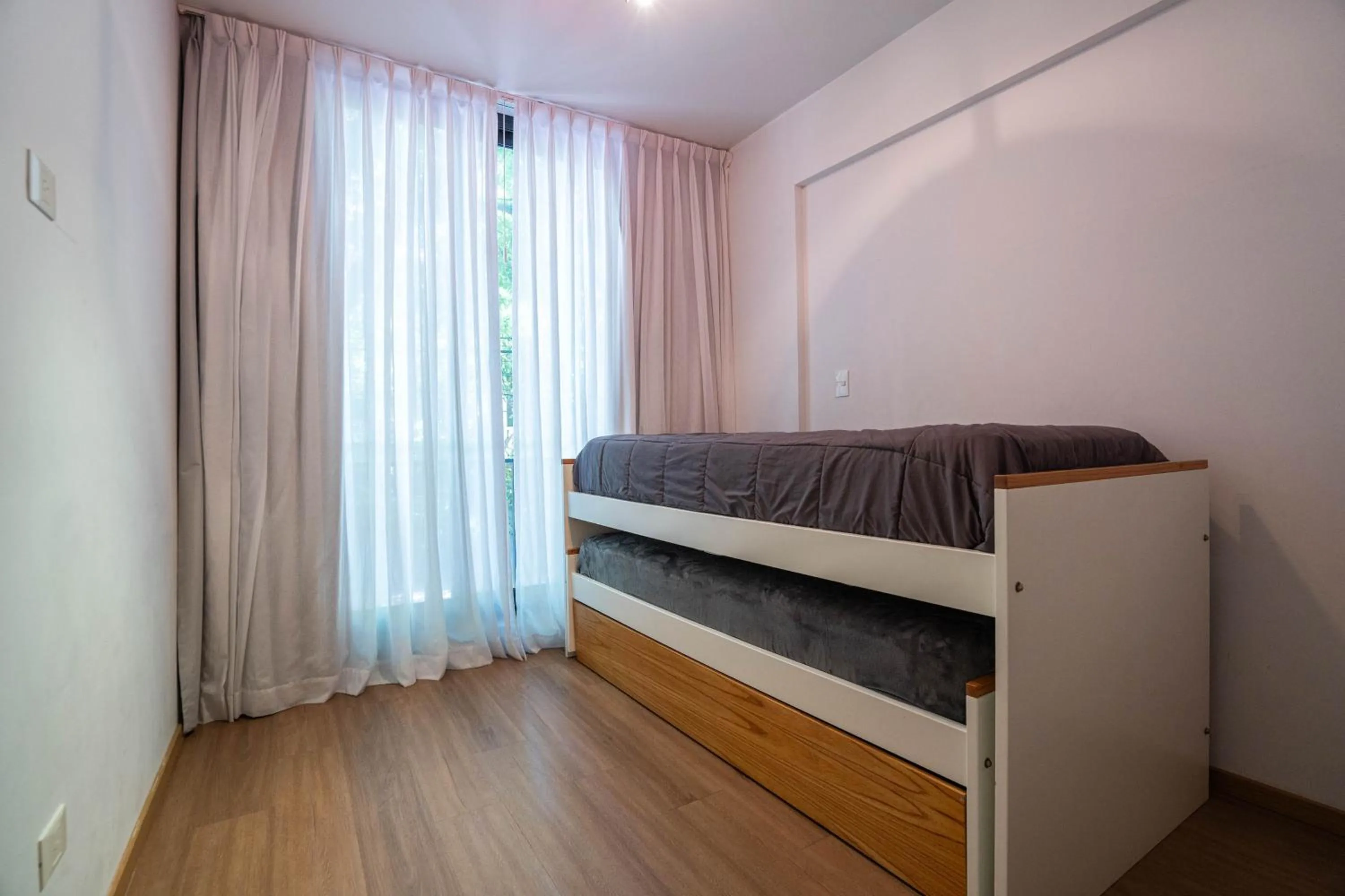 Bed in Monroe Suites