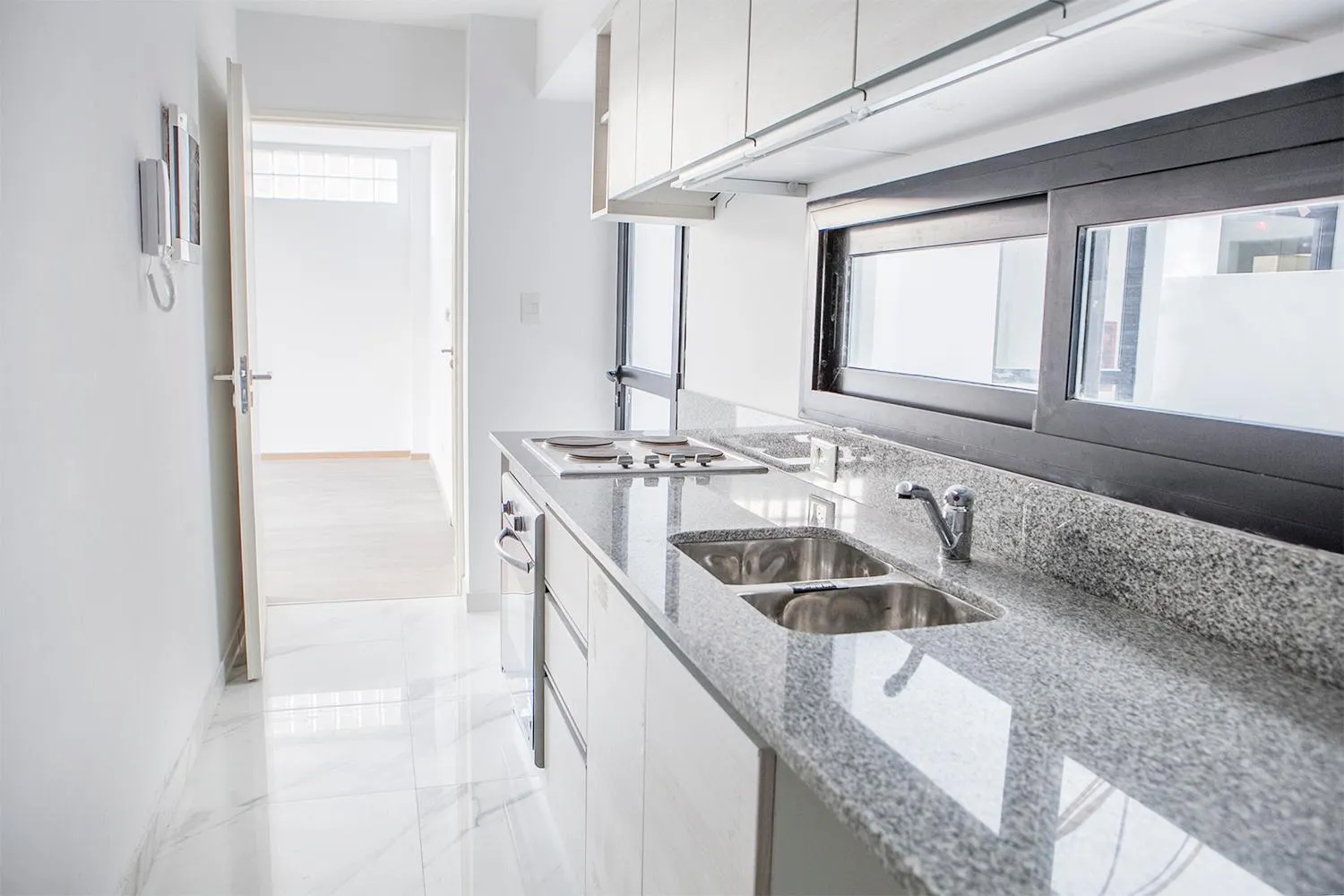 Kitchen or kitchenette in Monroe Suites