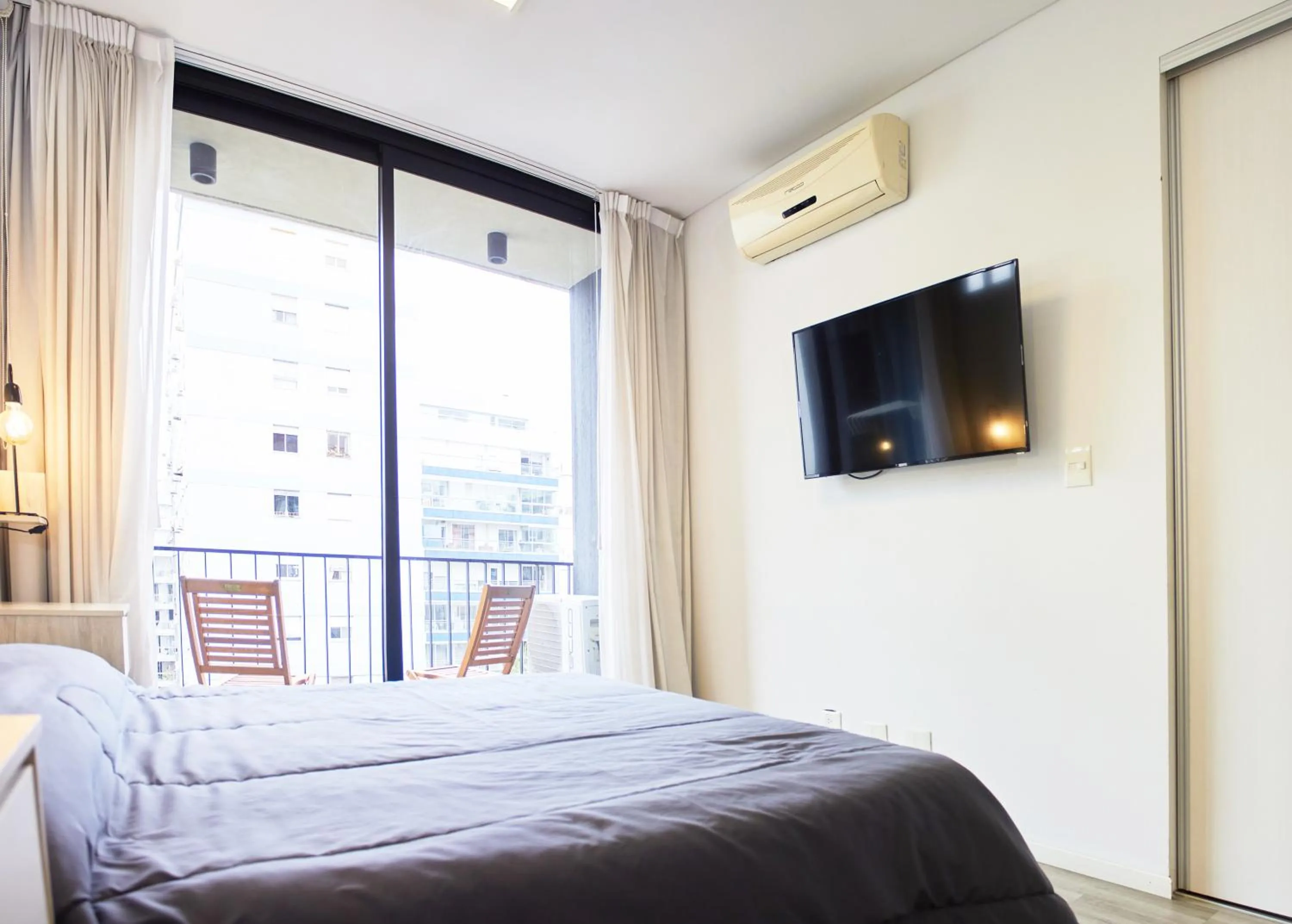 Bed in Monroe Suites