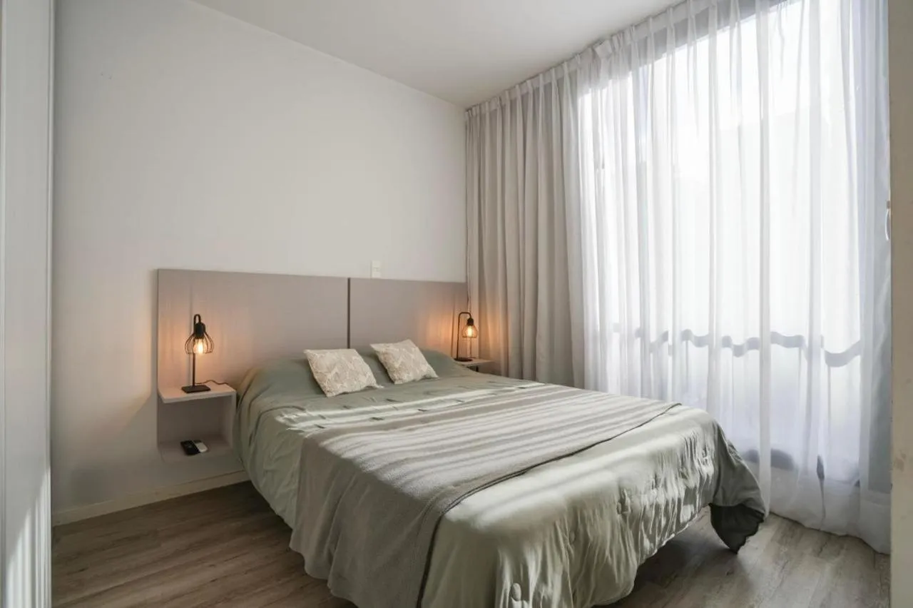 Bed in Monroe Suites