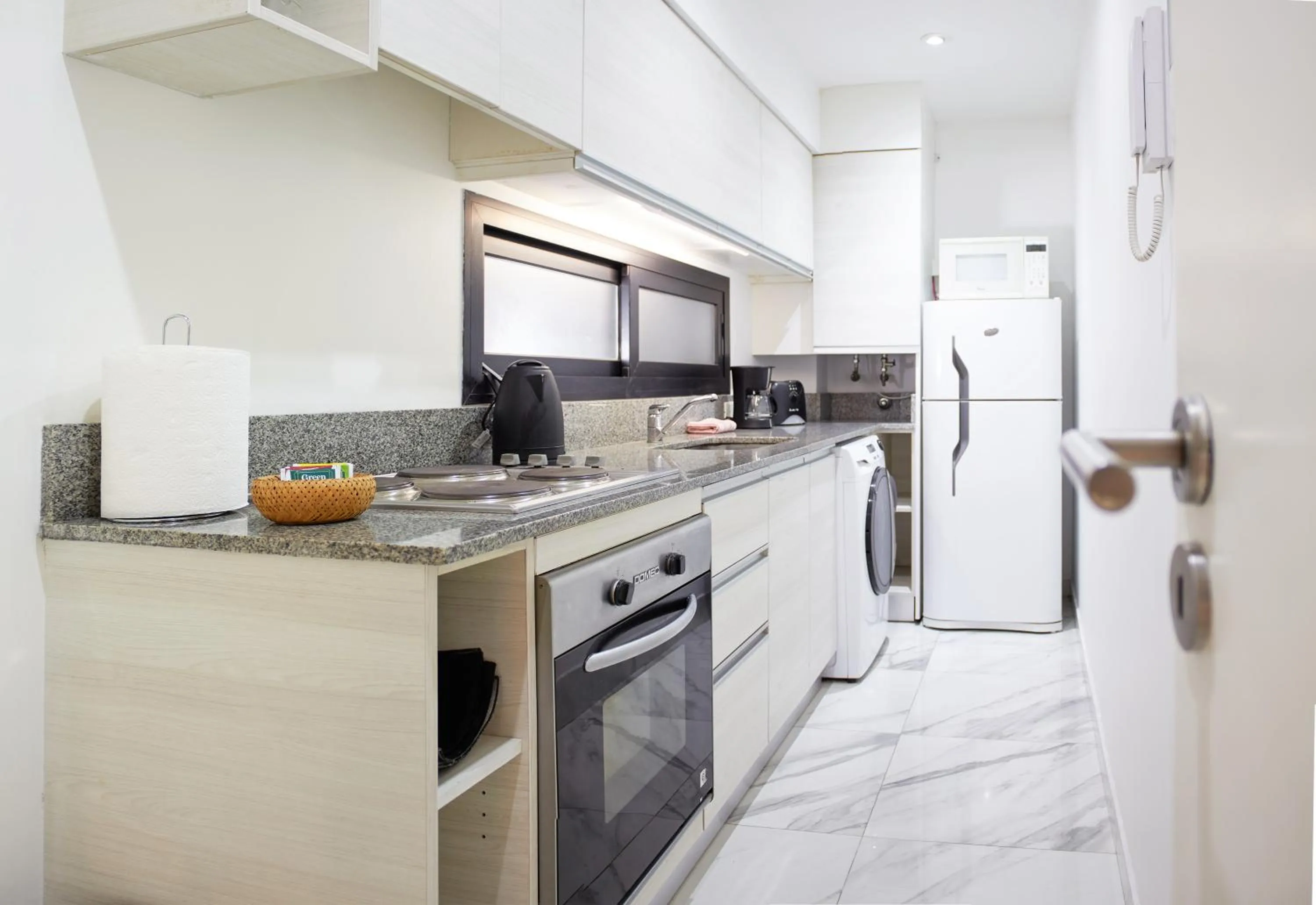 Kitchen or kitchenette in Monroe Suites