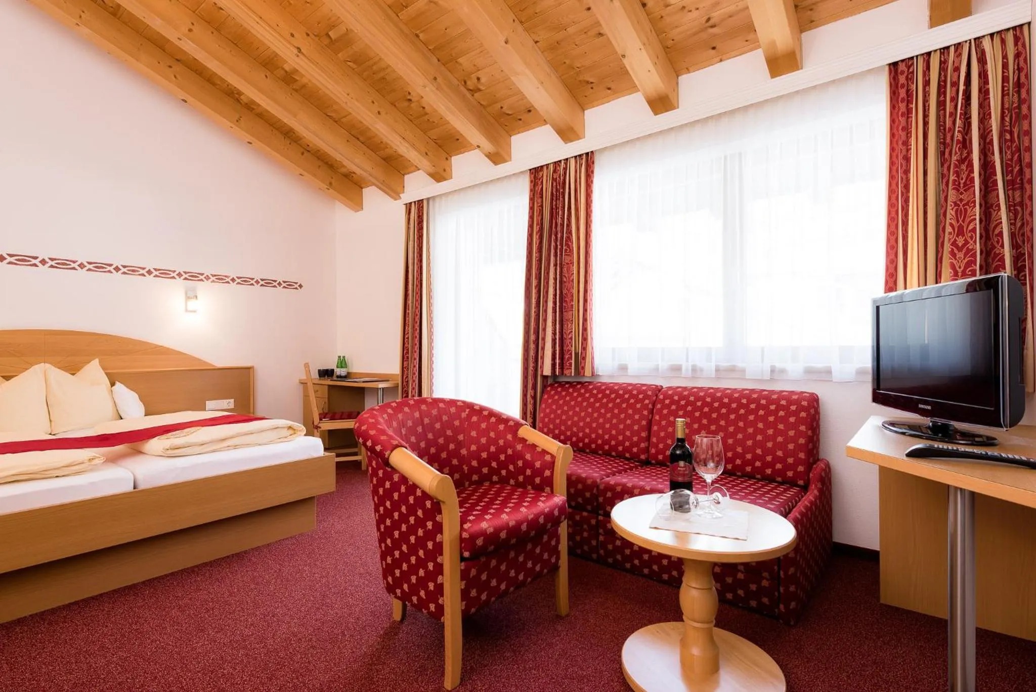 Seating area, Bed in Hotel Forer