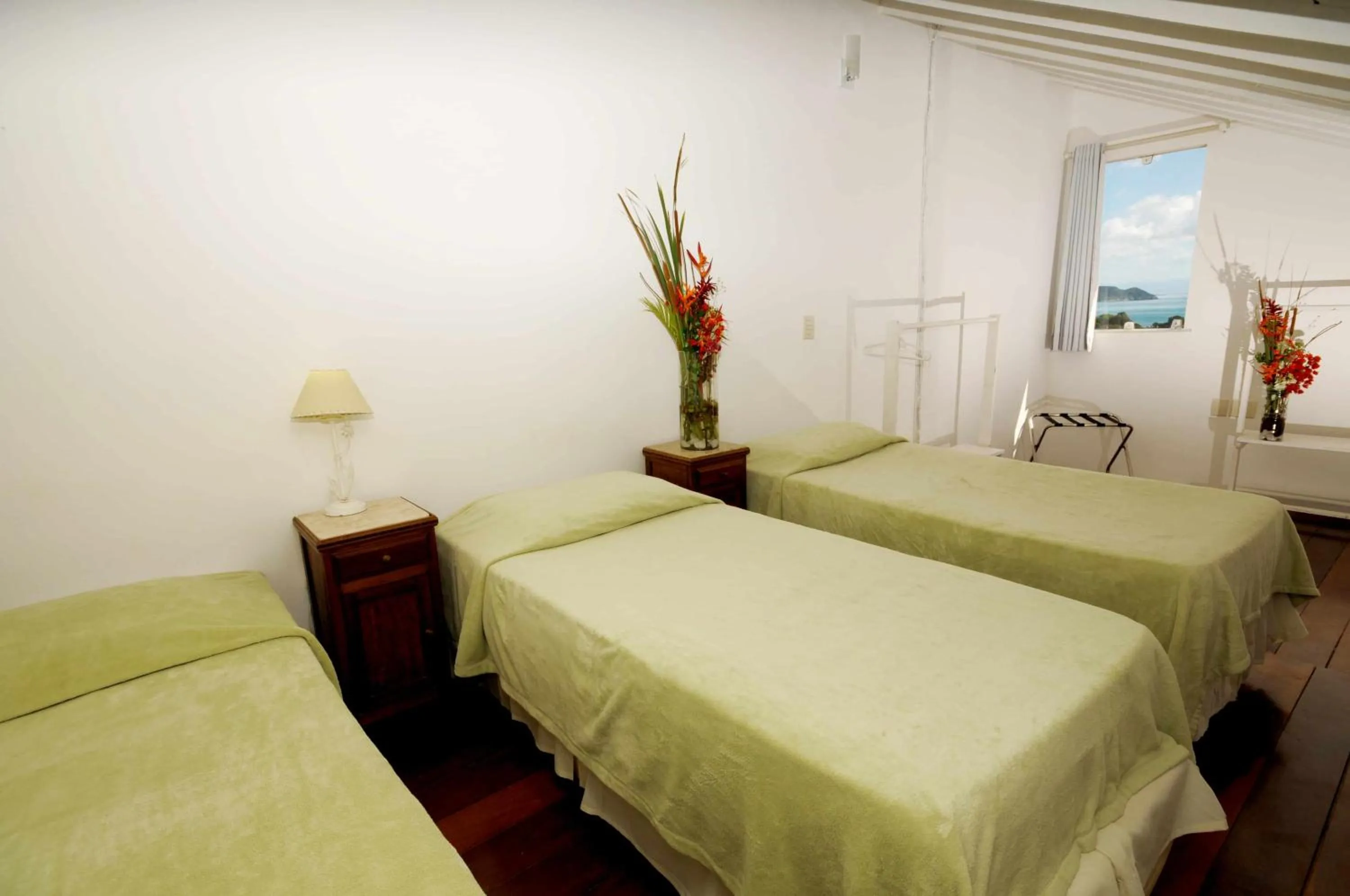 Bed in Pousada Pelicano