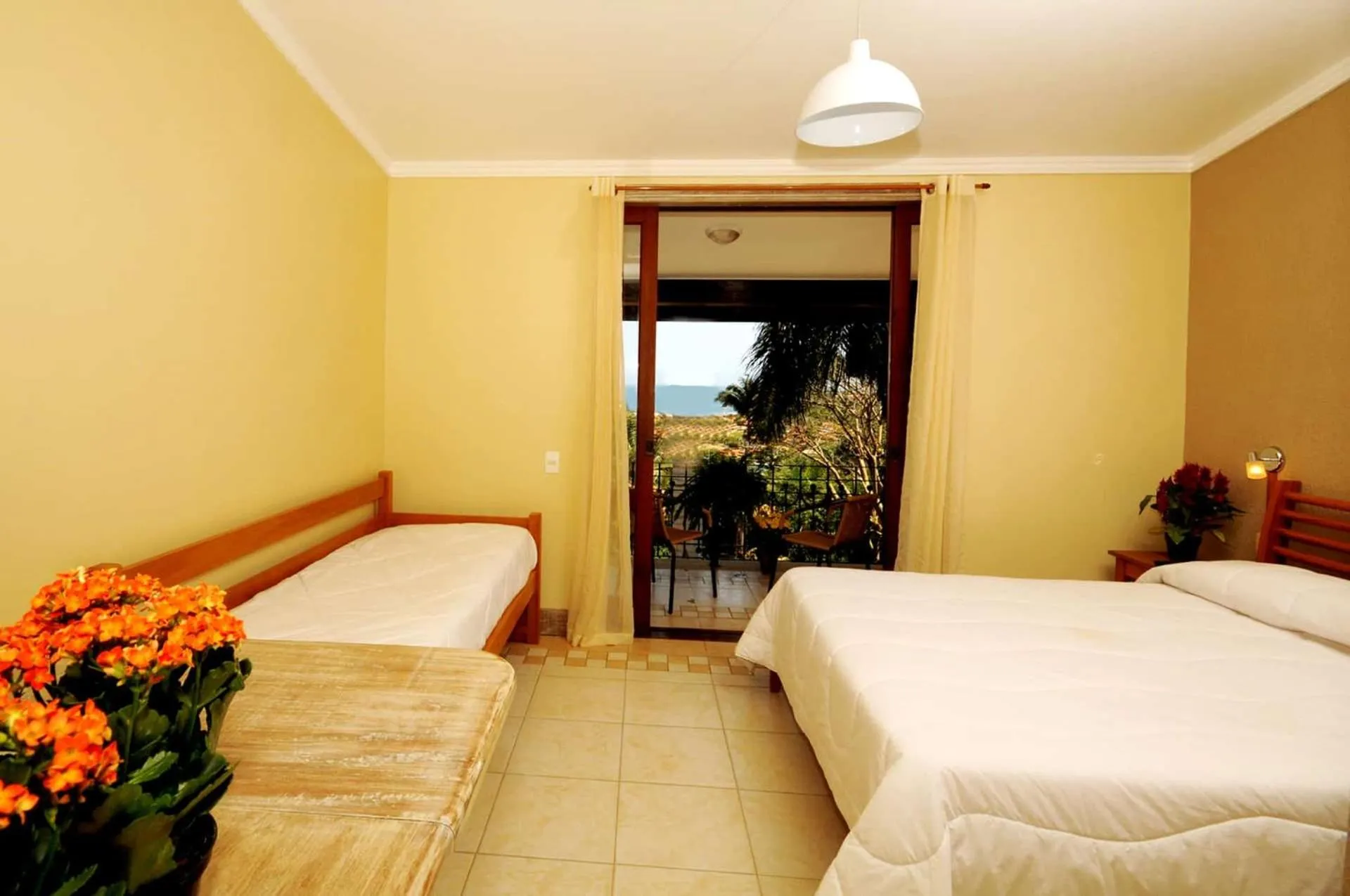 Bed in Pousada Pelicano