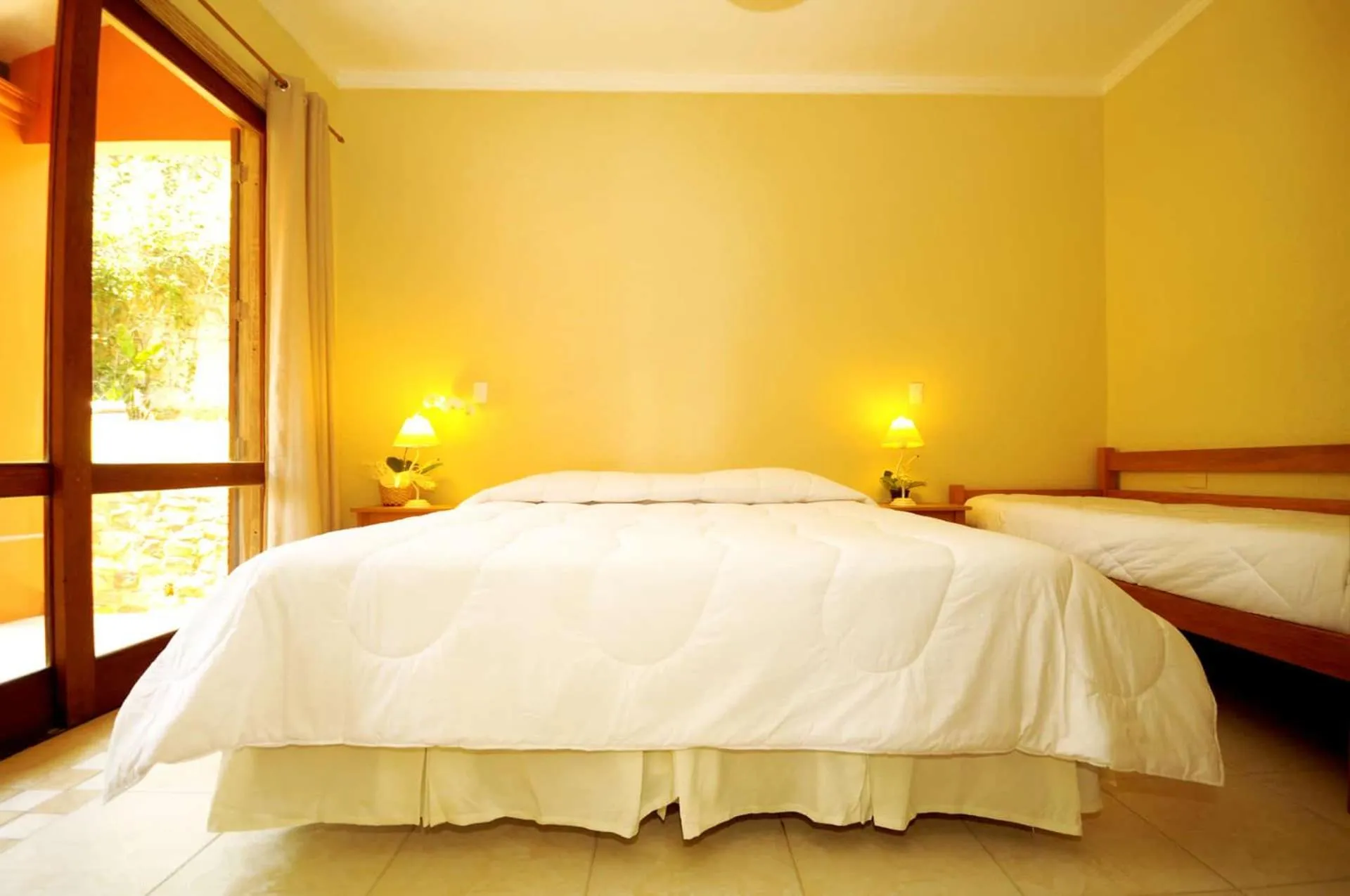 Bed in Pousada Pelicano