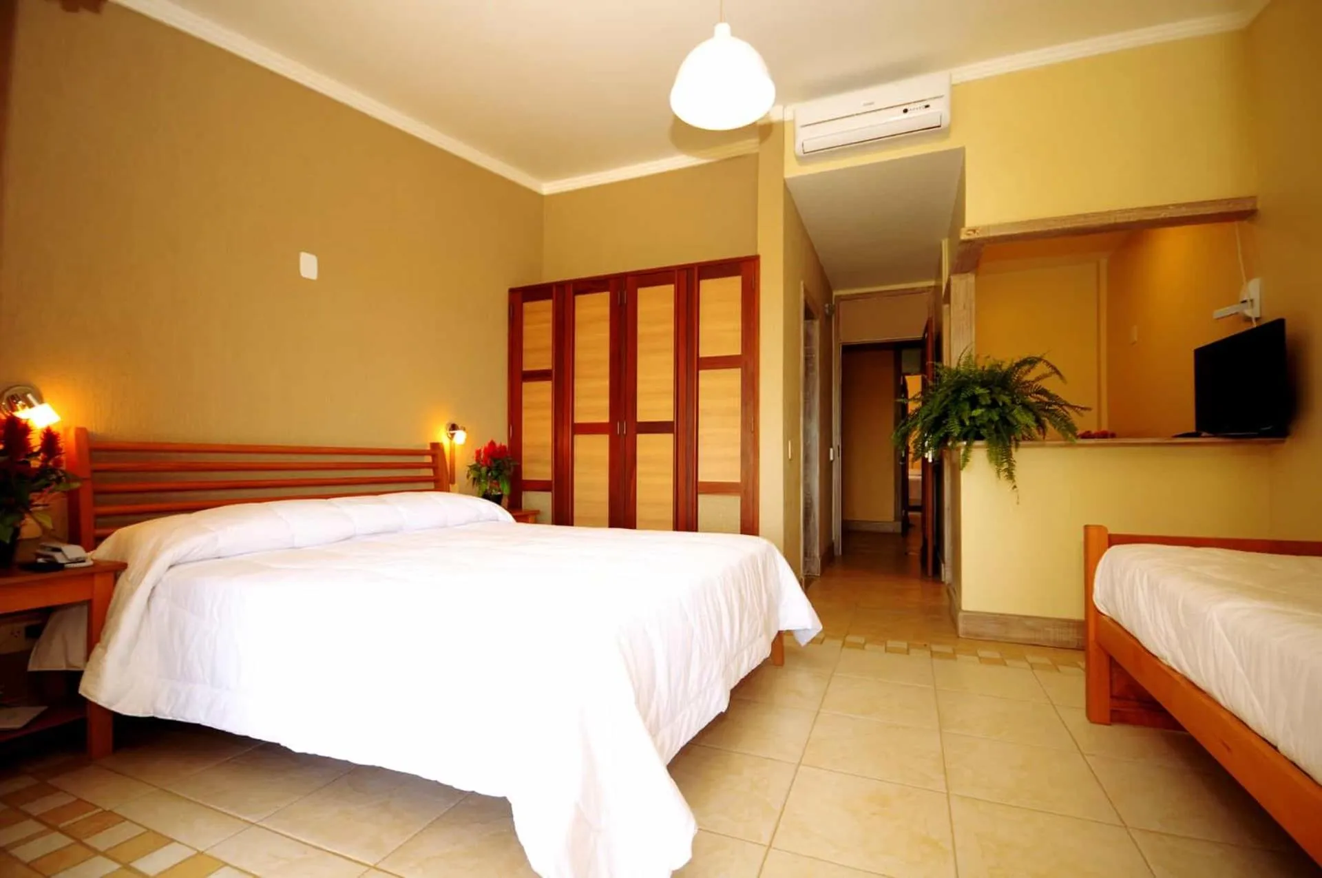 Bed in Pousada Pelicano