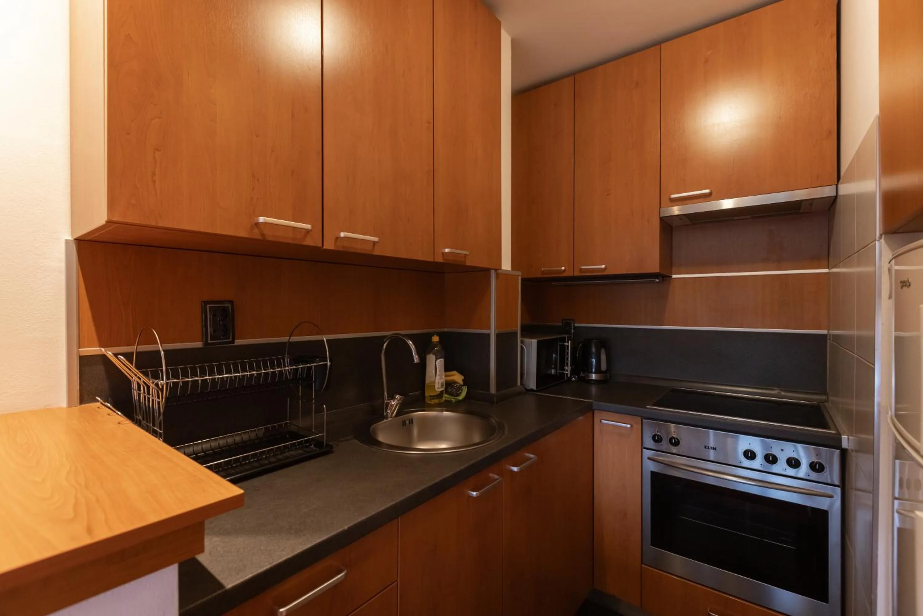 Kitchen or kitchenette in Central Park Apartments