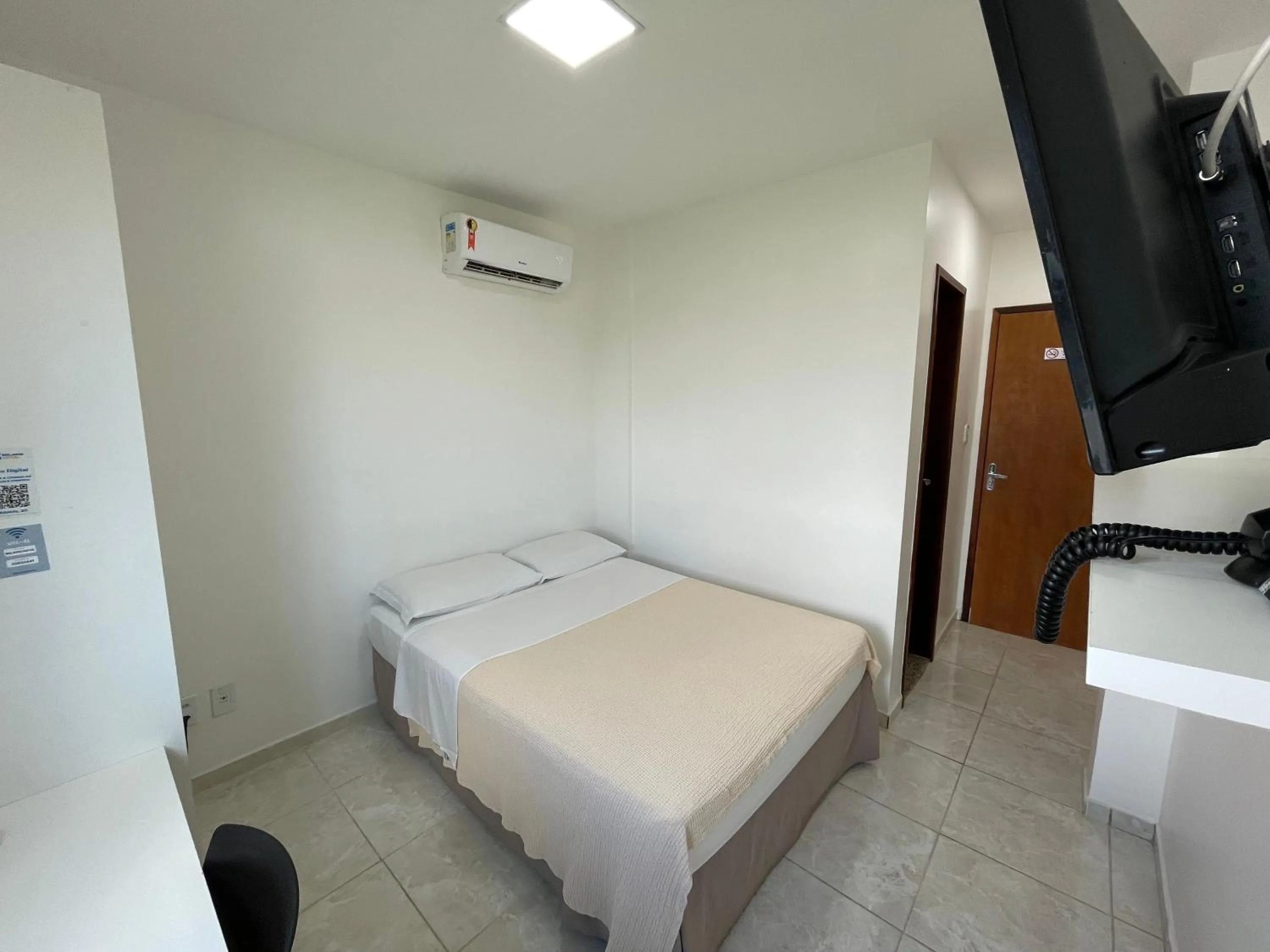 Bed in Belaris Hotel Executivo