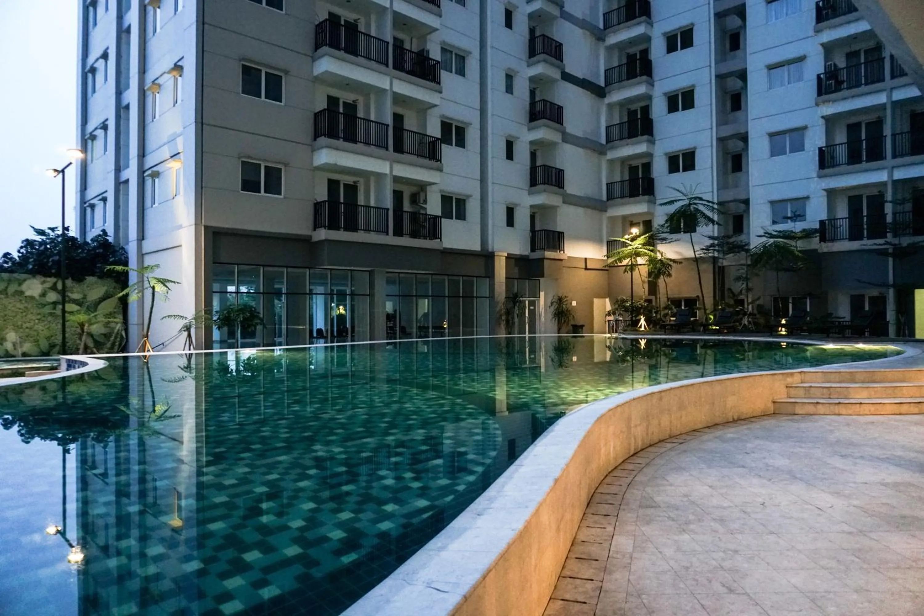 Swimming pool in City View Studio Apartment at Signature Park Grande By Travelio
