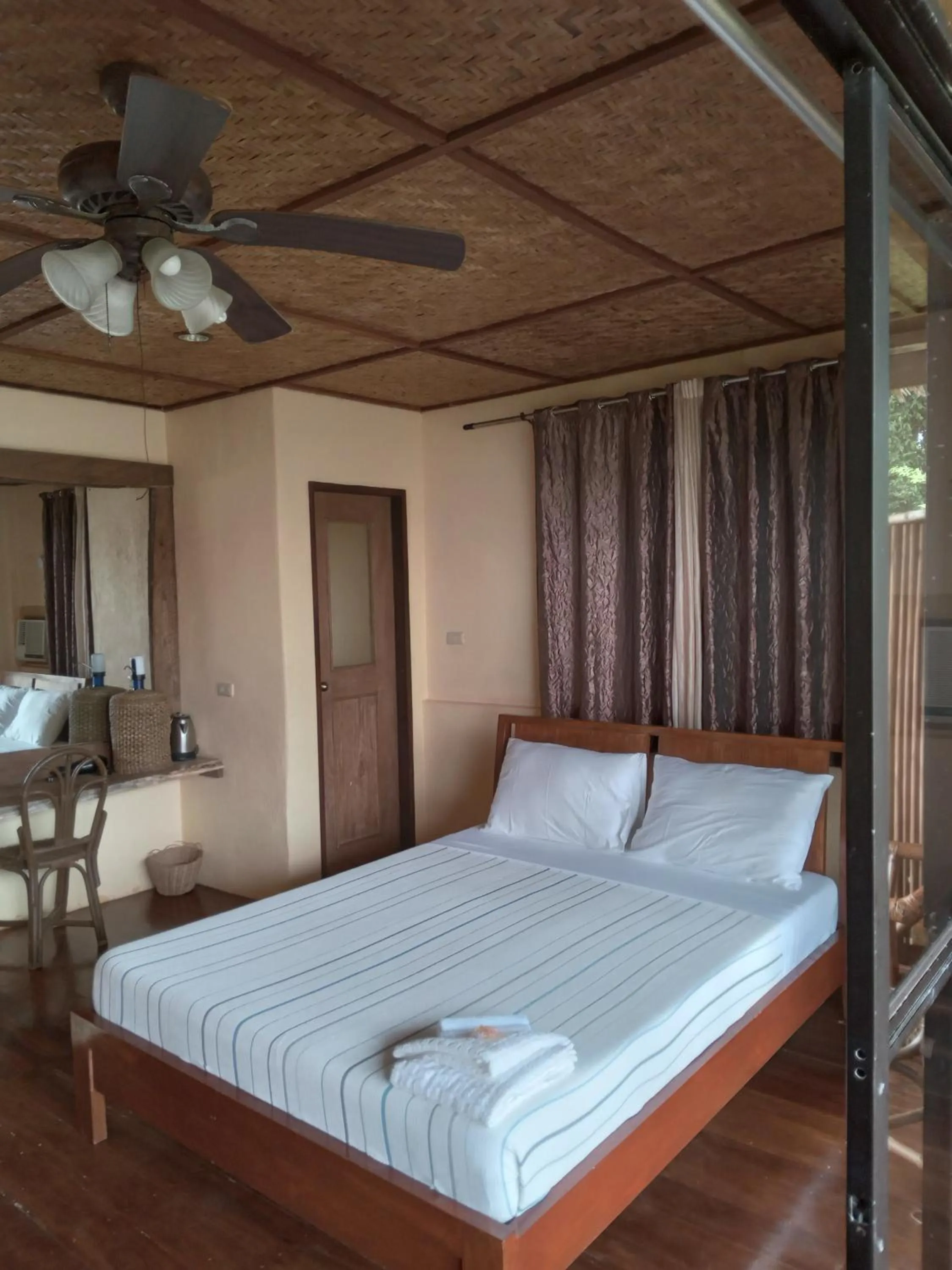 Bed in VILLA MARMARINE BEACH RESORT & RESTAURANT