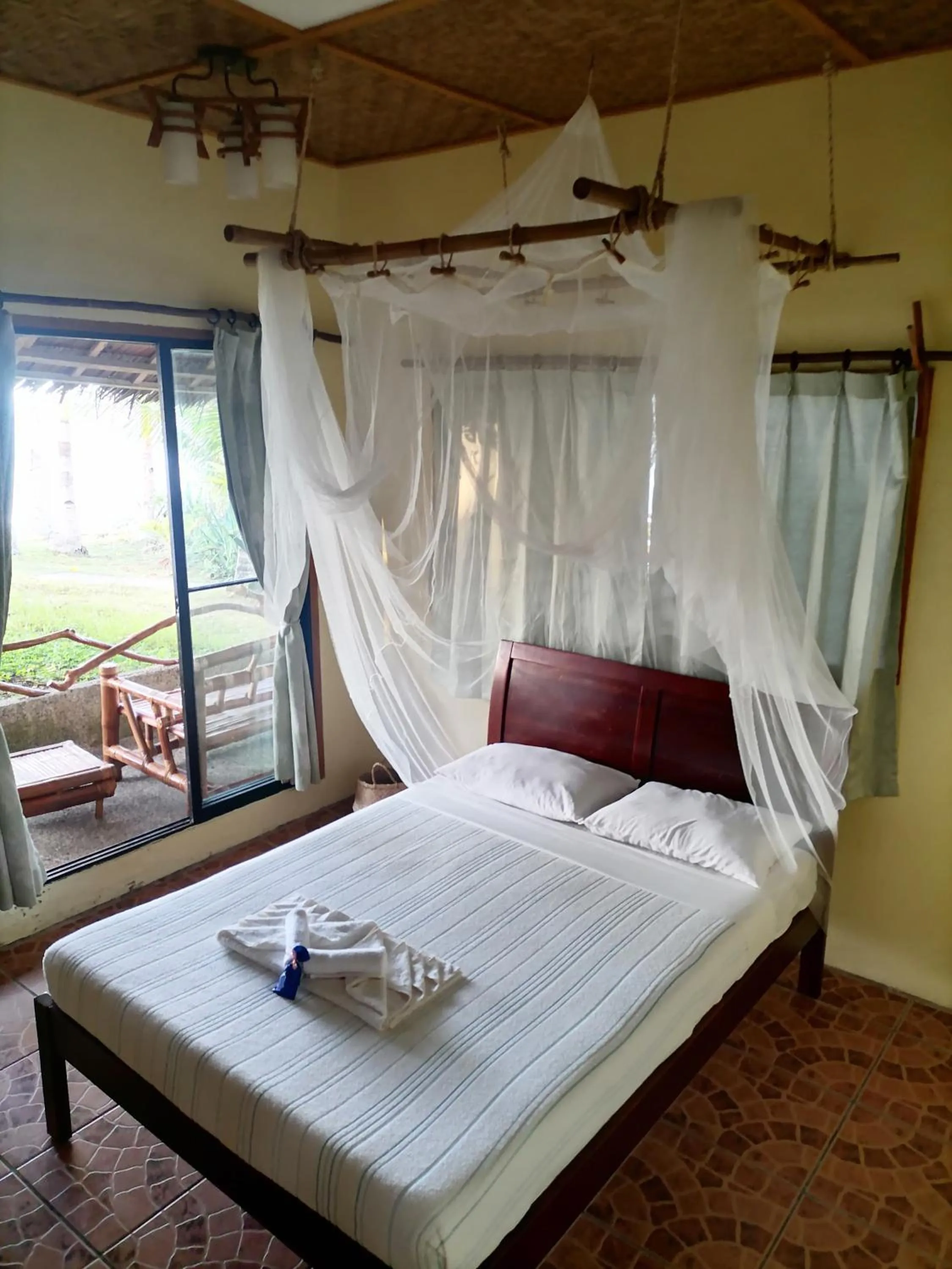 Bed in VILLA MARMARINE BEACH RESORT & RESTAURANT