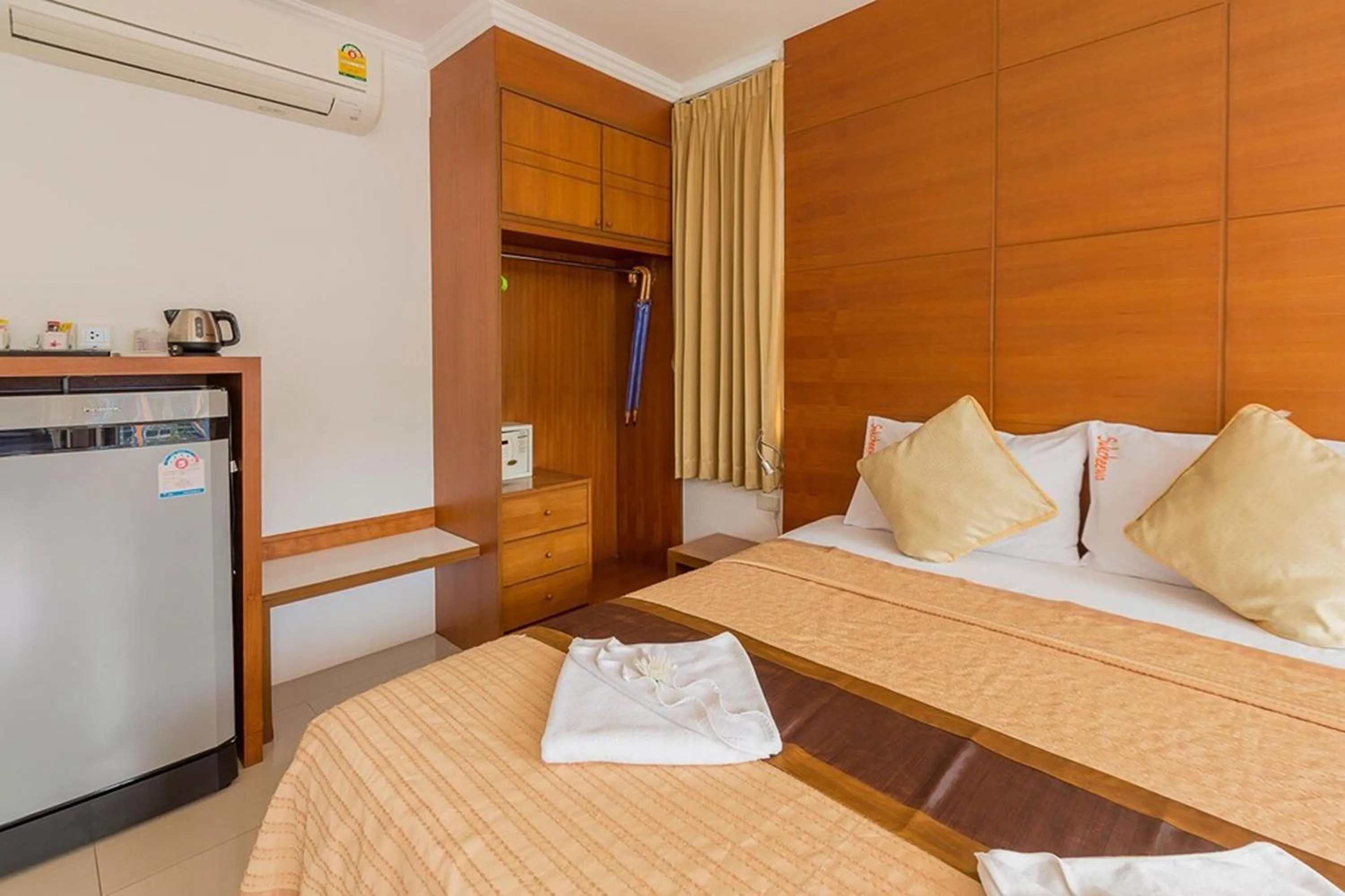 Bed in Sukcheewa Residence Phuket