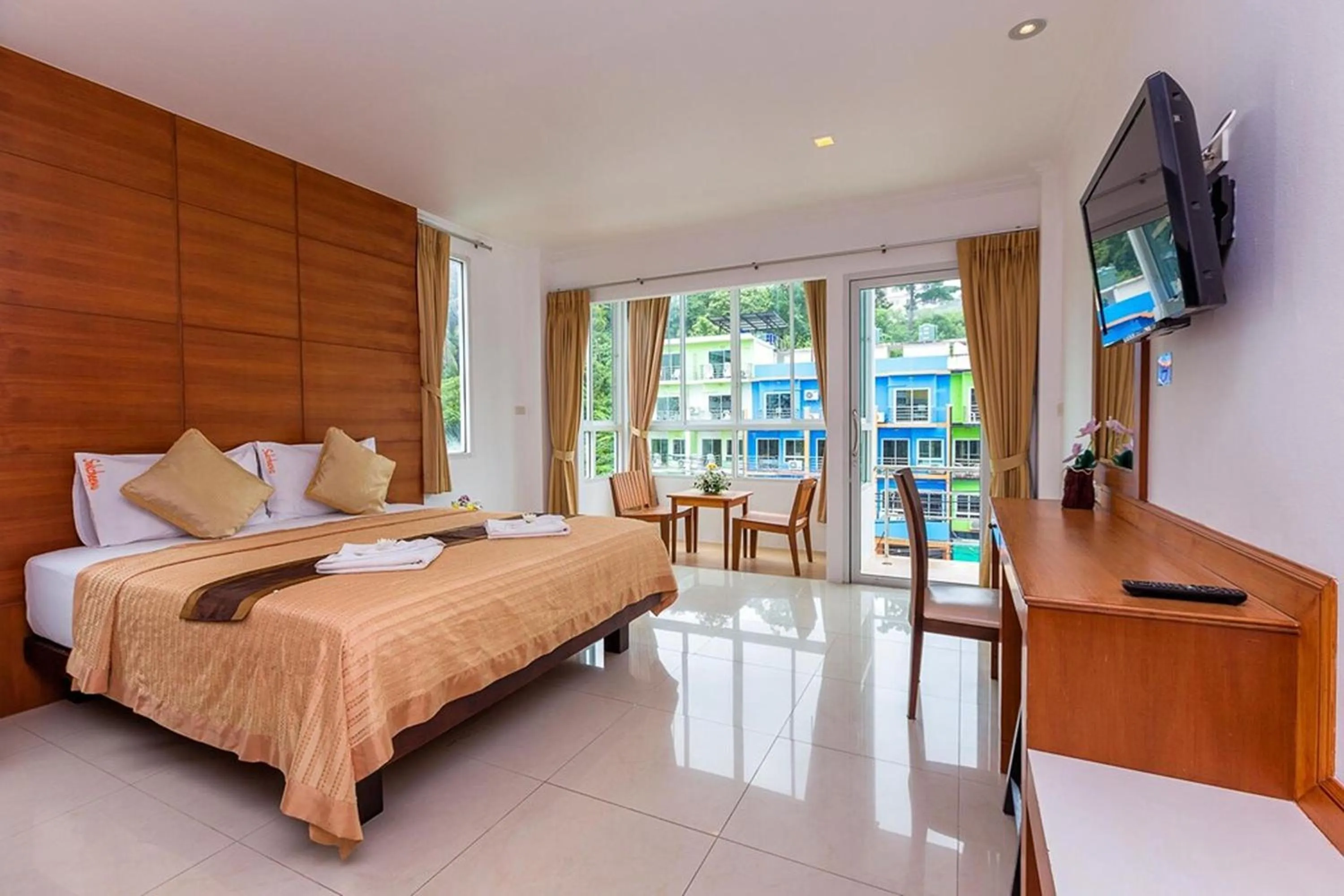 Bed in Sukcheewa Residence Phuket