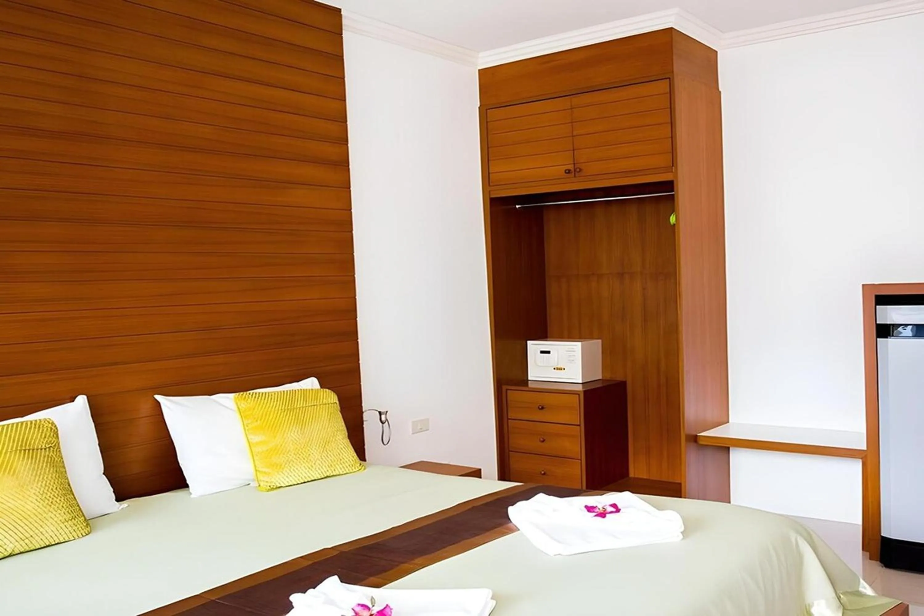 Bed in Sukcheewa Residence Phuket