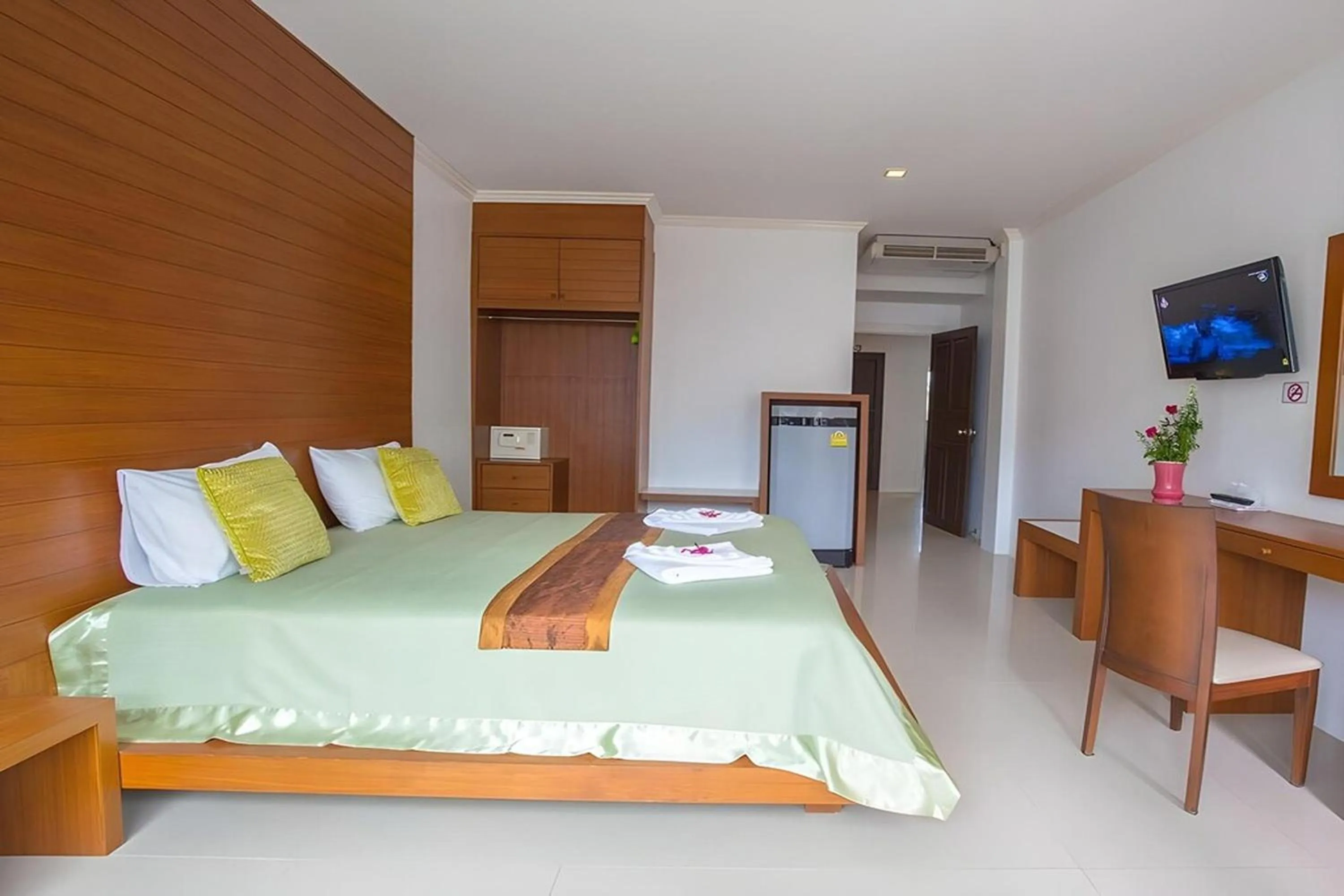 Bed in Sukcheewa Residence Phuket