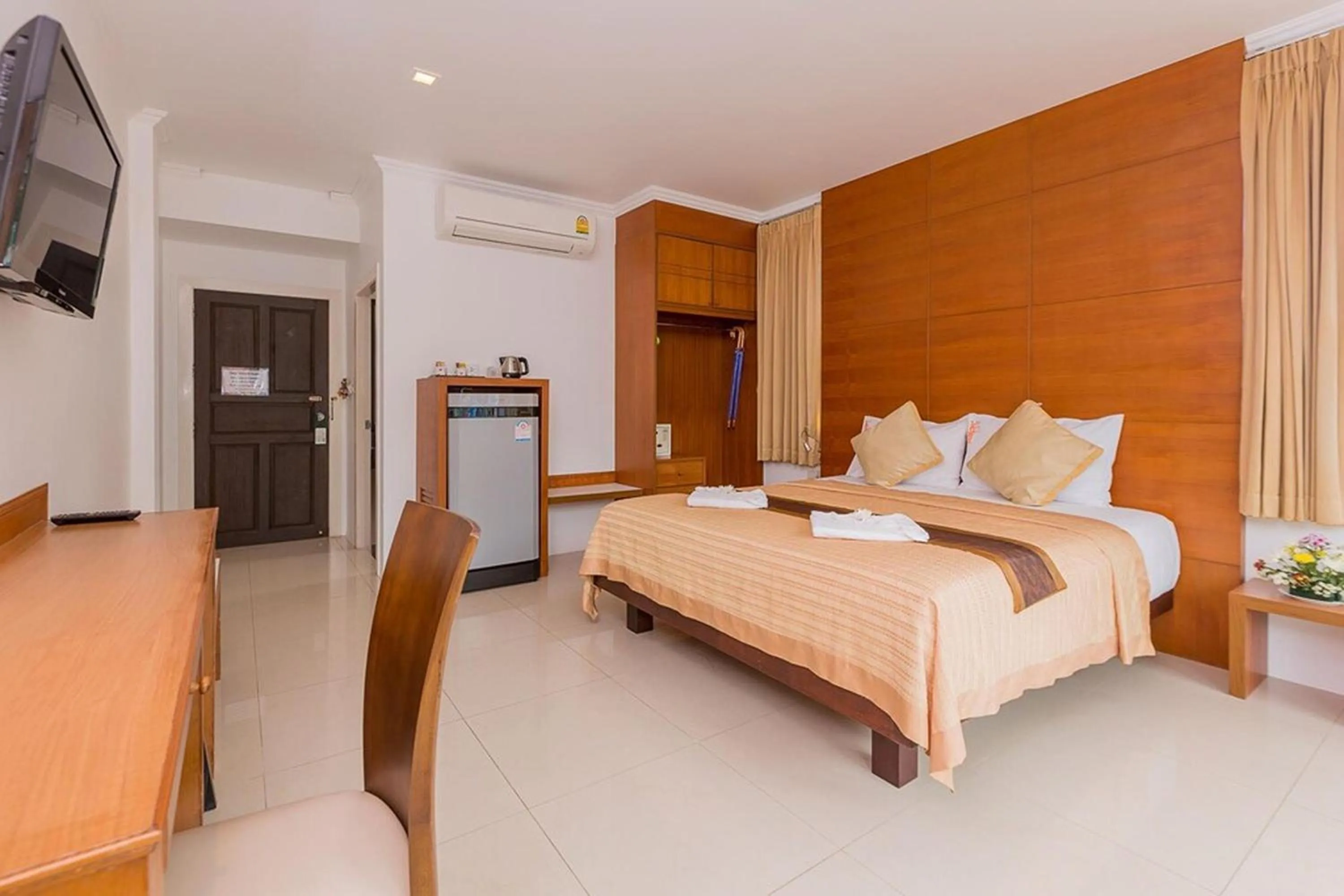 Bed in Sukcheewa Residence Phuket