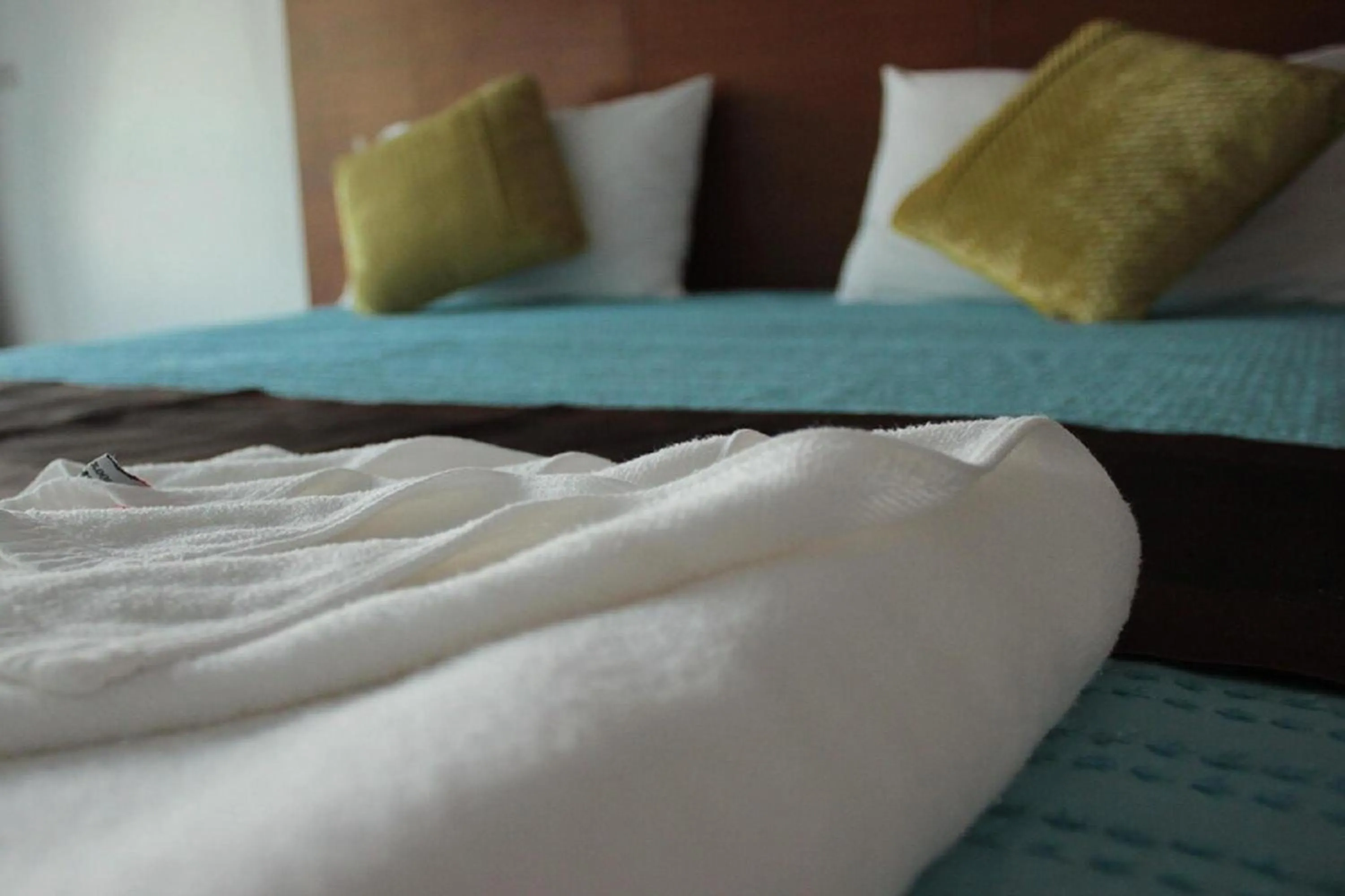 Bed in Sukcheewa Residence Phuket