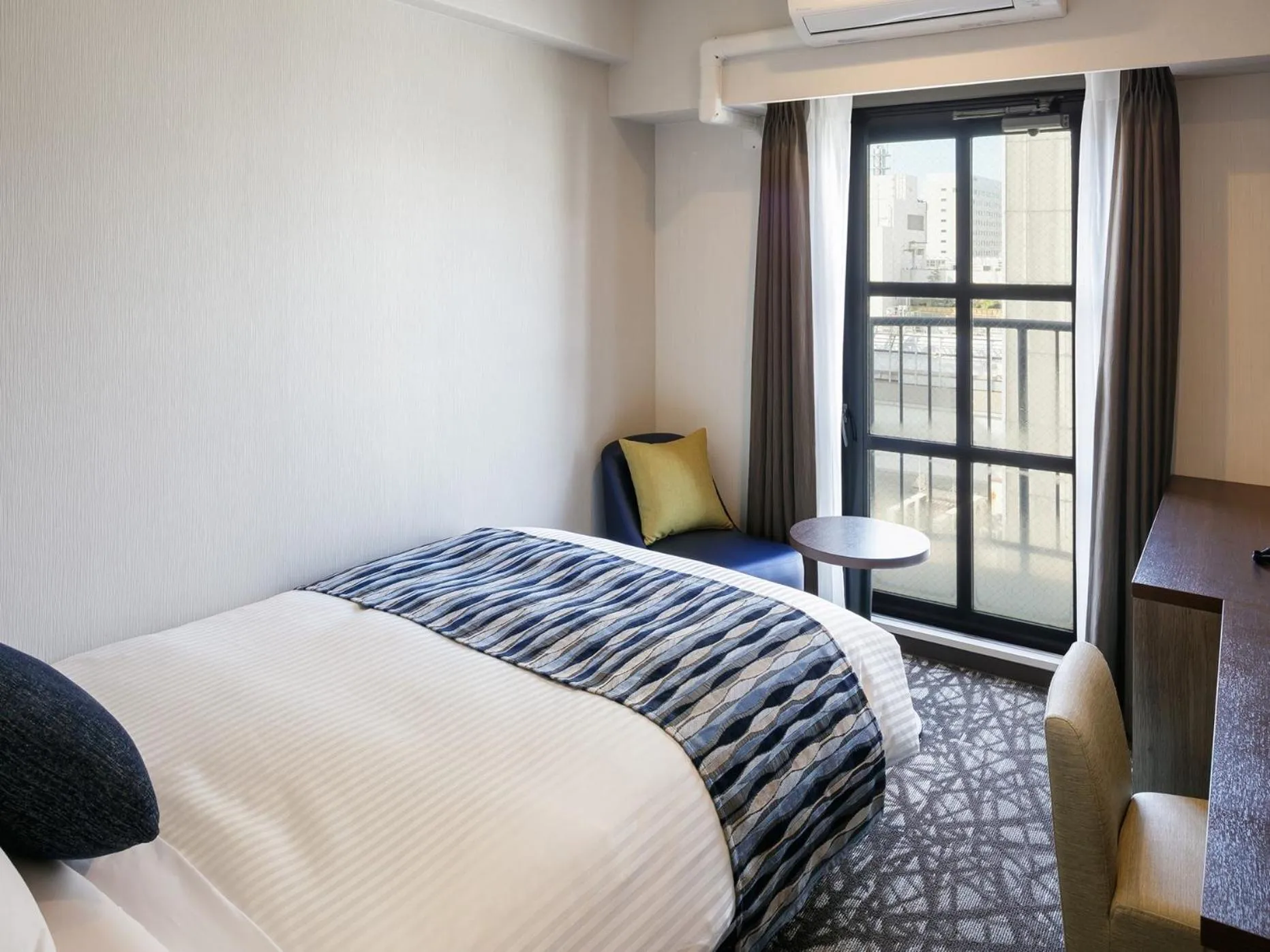 Bed in Hotel Mystays Kagoshima Tenmonkan Annex