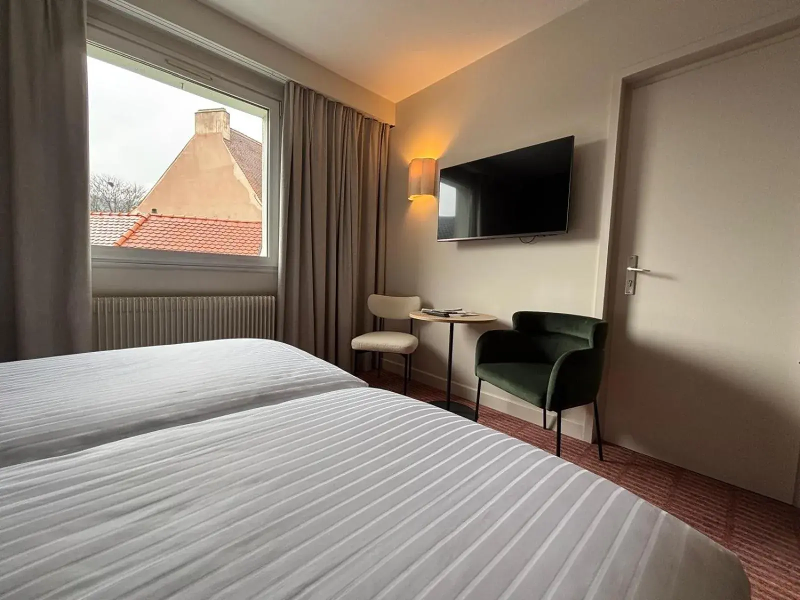 Bed in Logis Hotel L'Ours de Mutzig Bed in Logis Hotel L'Ours de Mutzig