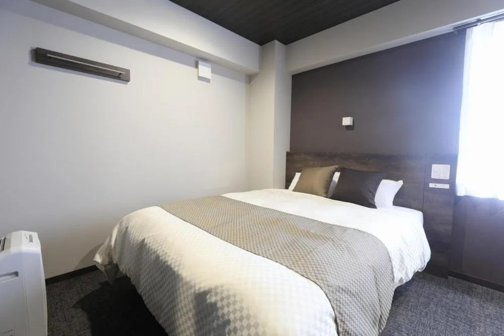 Bed in The Celecton Tsuchiura Ekimae