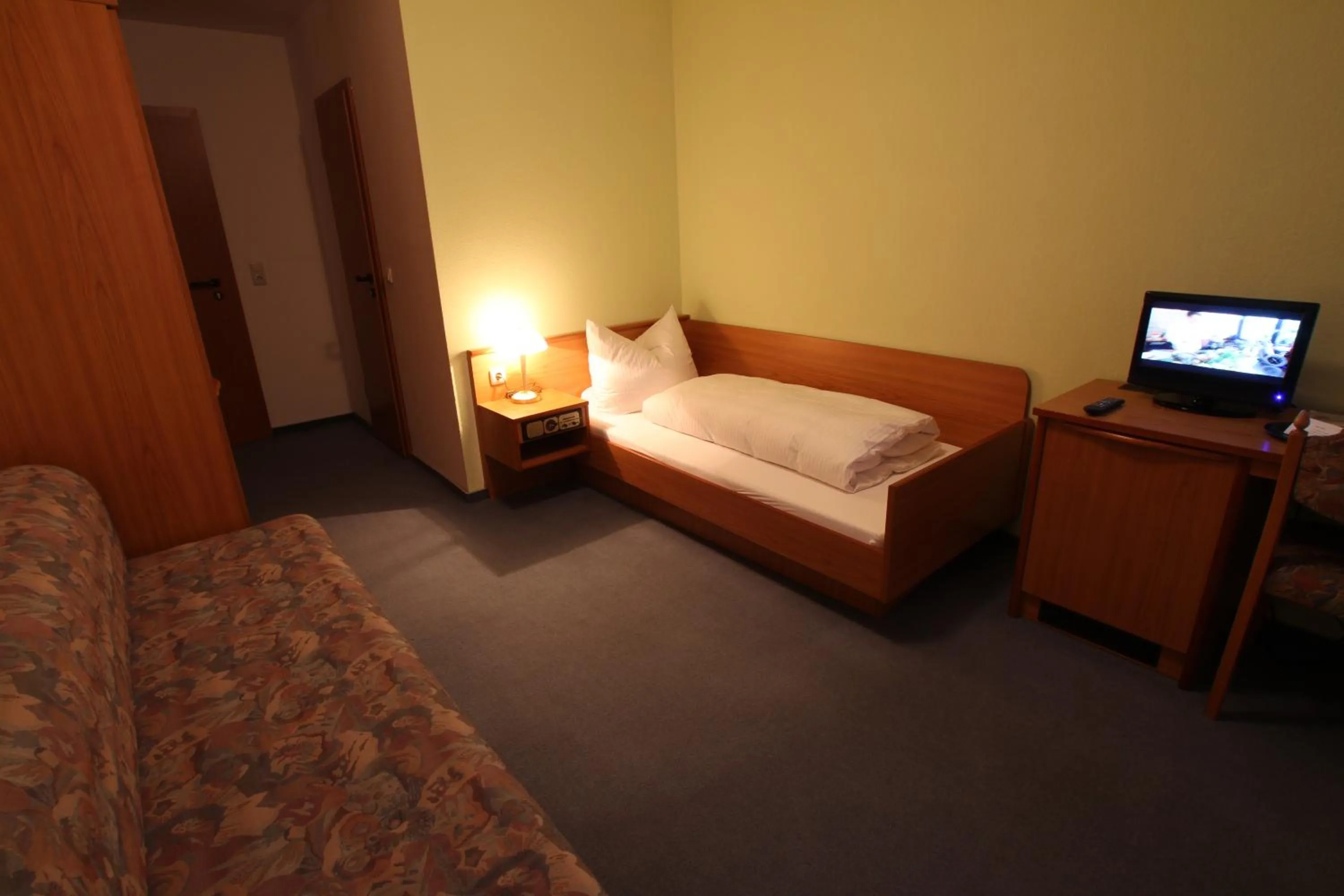 Photo of the whole room, Bed in Hotel Weisse Taube