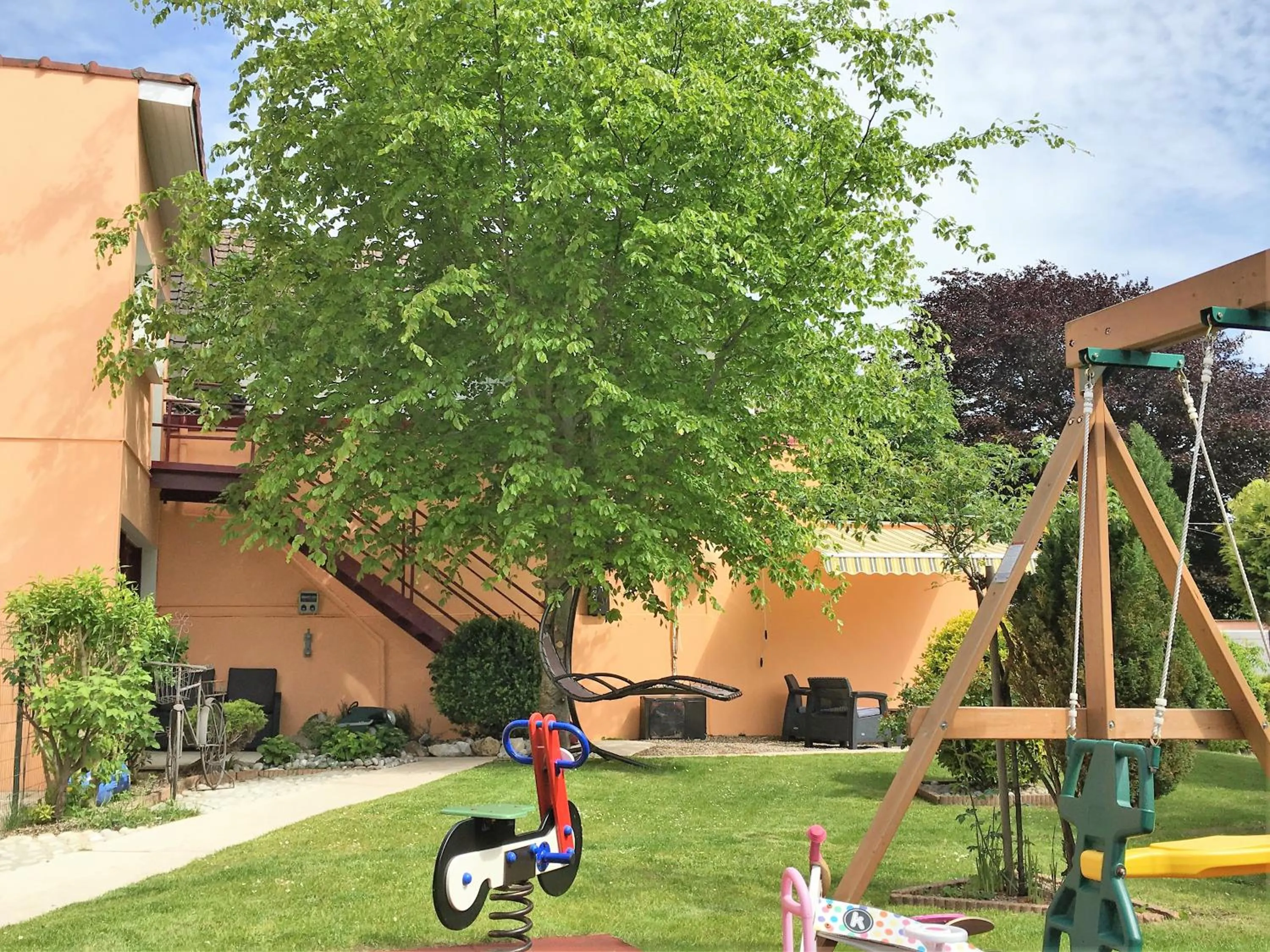 Children play ground in Hôtel et Appart 'hôtel Chez Gino ETAPLES-Le Touquet