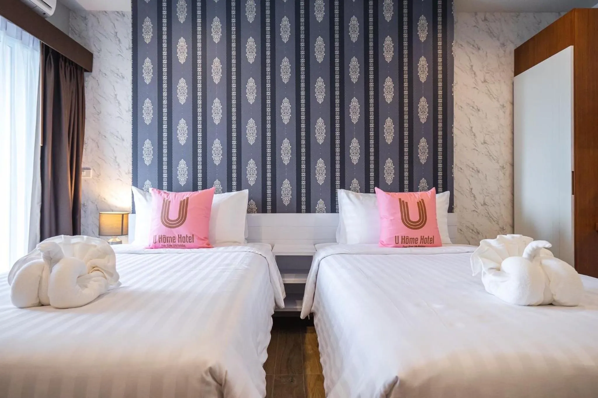 Bed in U- Homehotel Nakhonpanom