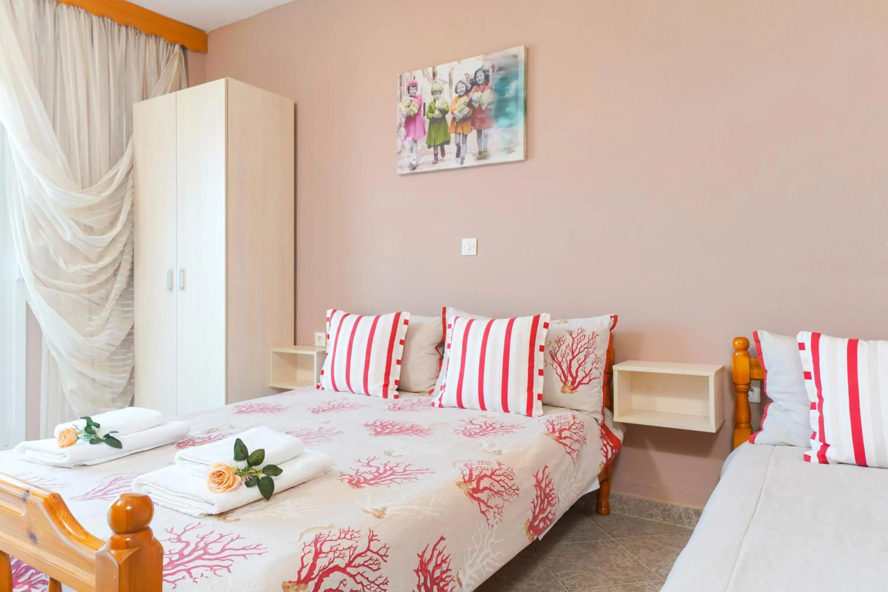 Bed in Athanasia Rooms