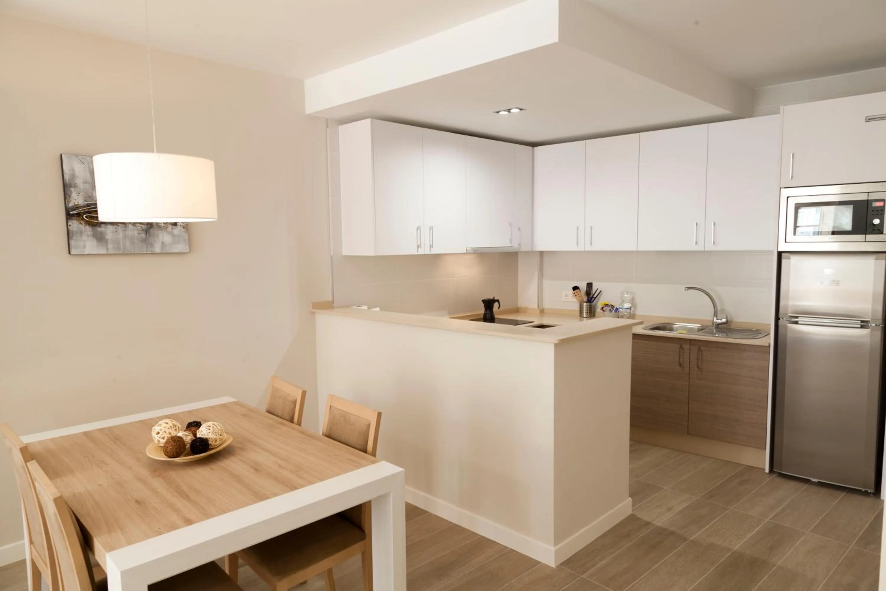 Kitchen or kitchenette in Apartamentos Pinar Malaga Centro