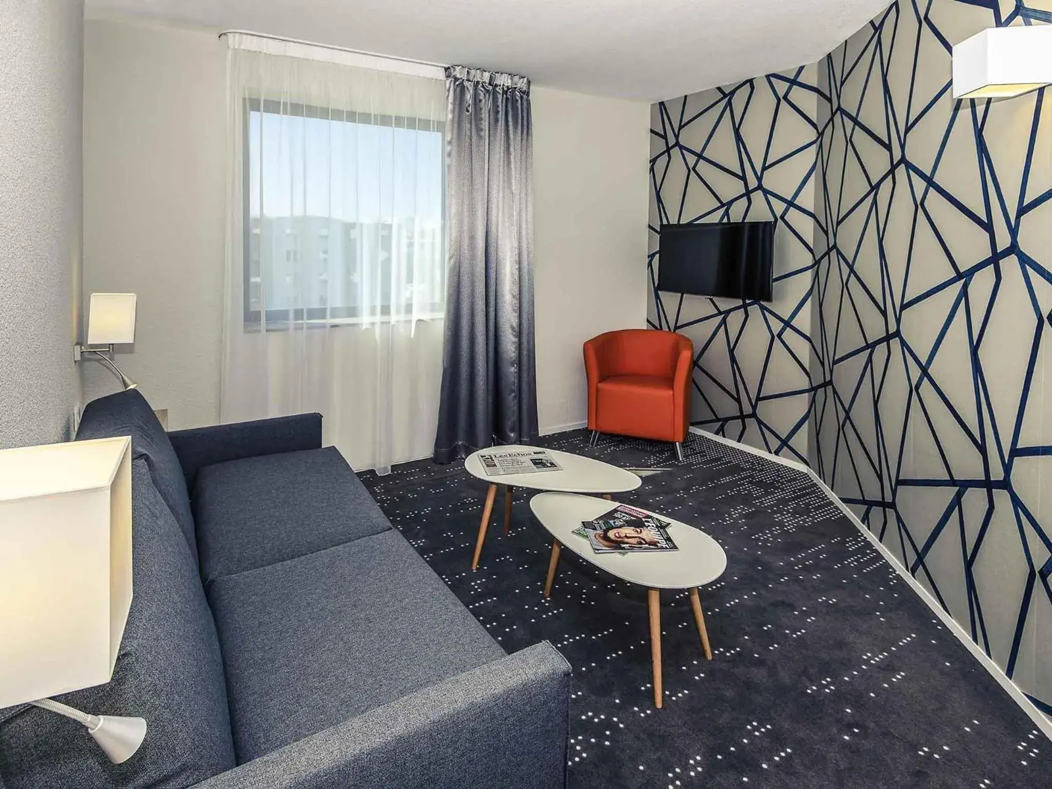 Bedroom in Mercure Poitiers Site du Futuroscope Bedroom in Mercure Poitiers Site du Futuroscope