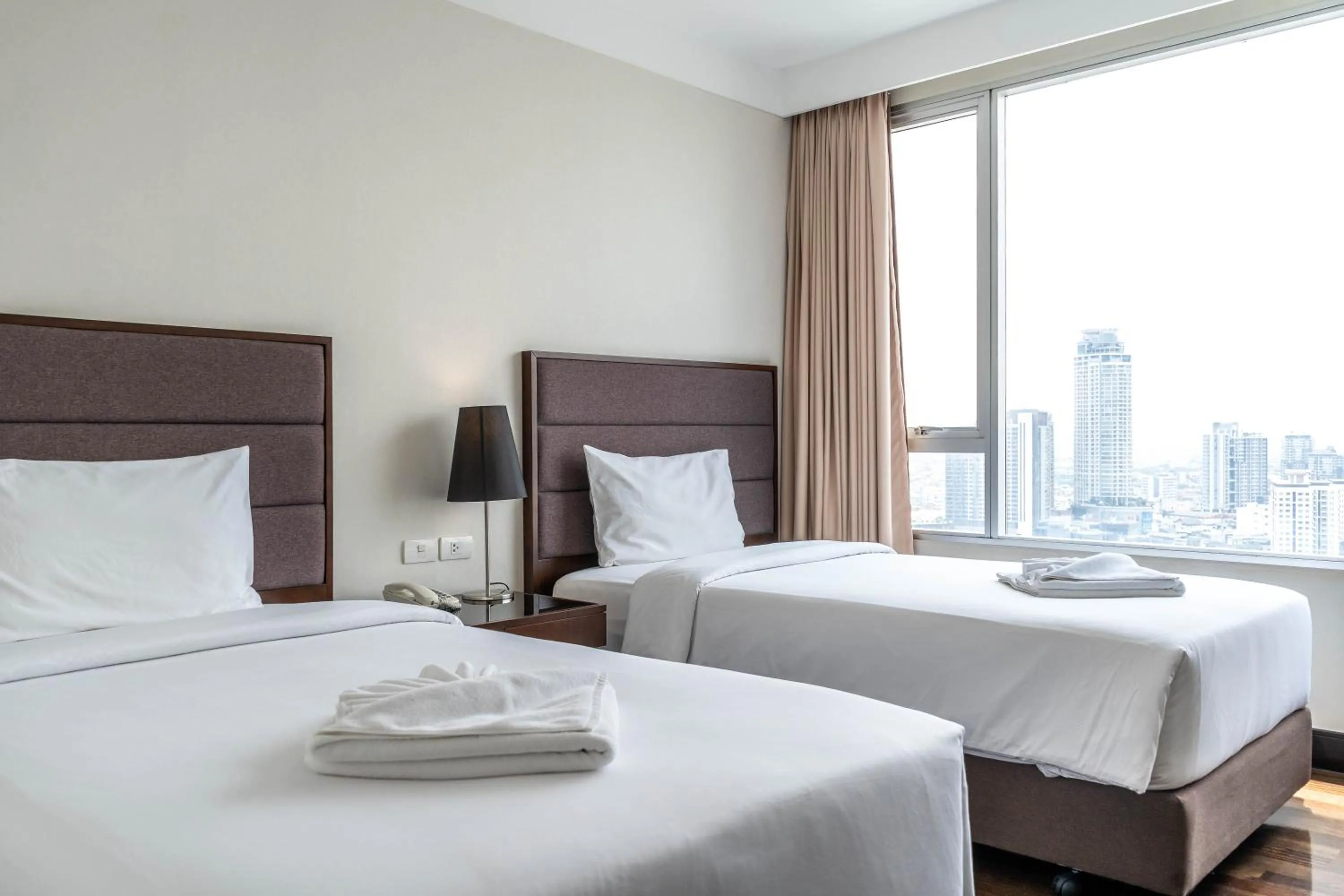 Bed in Jasmine Grande Residence