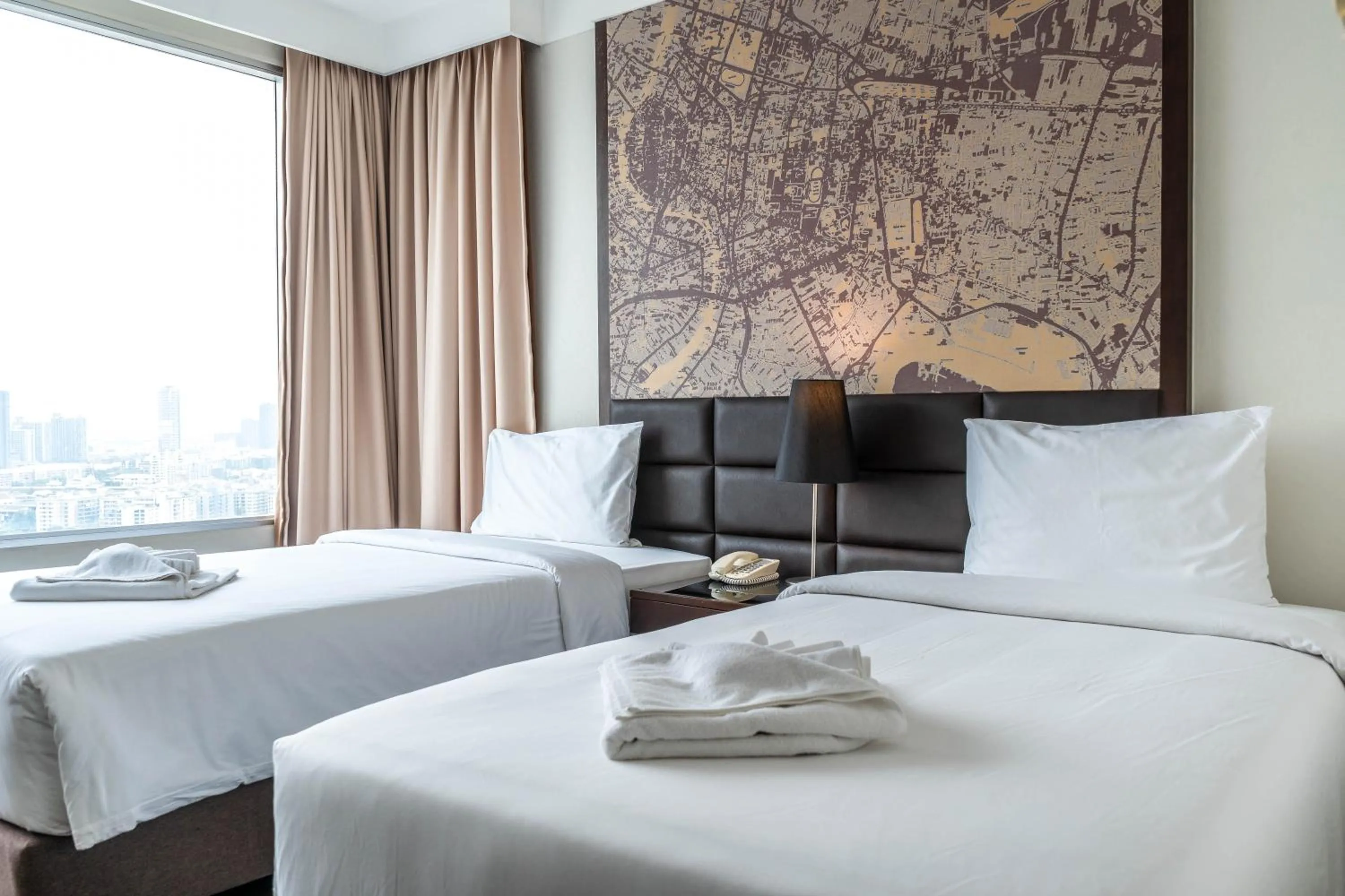 Bed in Jasmine Grande Residence