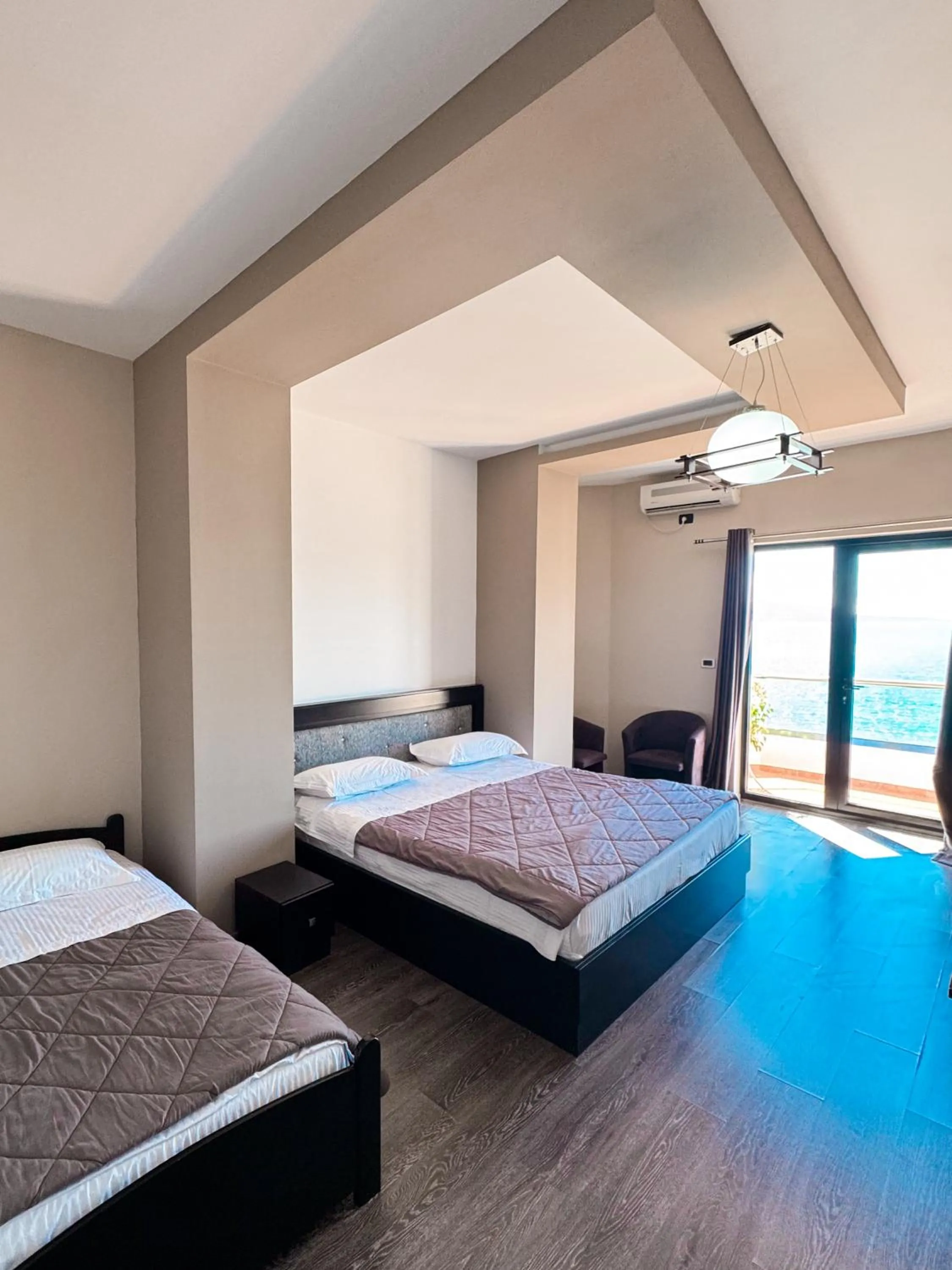 Photo of the whole room, Bed in New Heaven Hotel